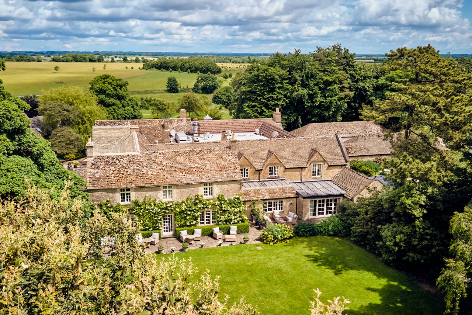 Spend an afternoon next to an open fire in the outdoor hot tub at Calcot Manor