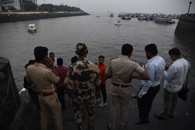 <p>Passengers who were rescued after a boat that capsized off the coast in Mumbai, India on December 18</p>