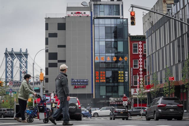 <p>File: A six story glass facade building, center, alleged to be the site of a foreign police outpost for China in New York's Chinatown </p>