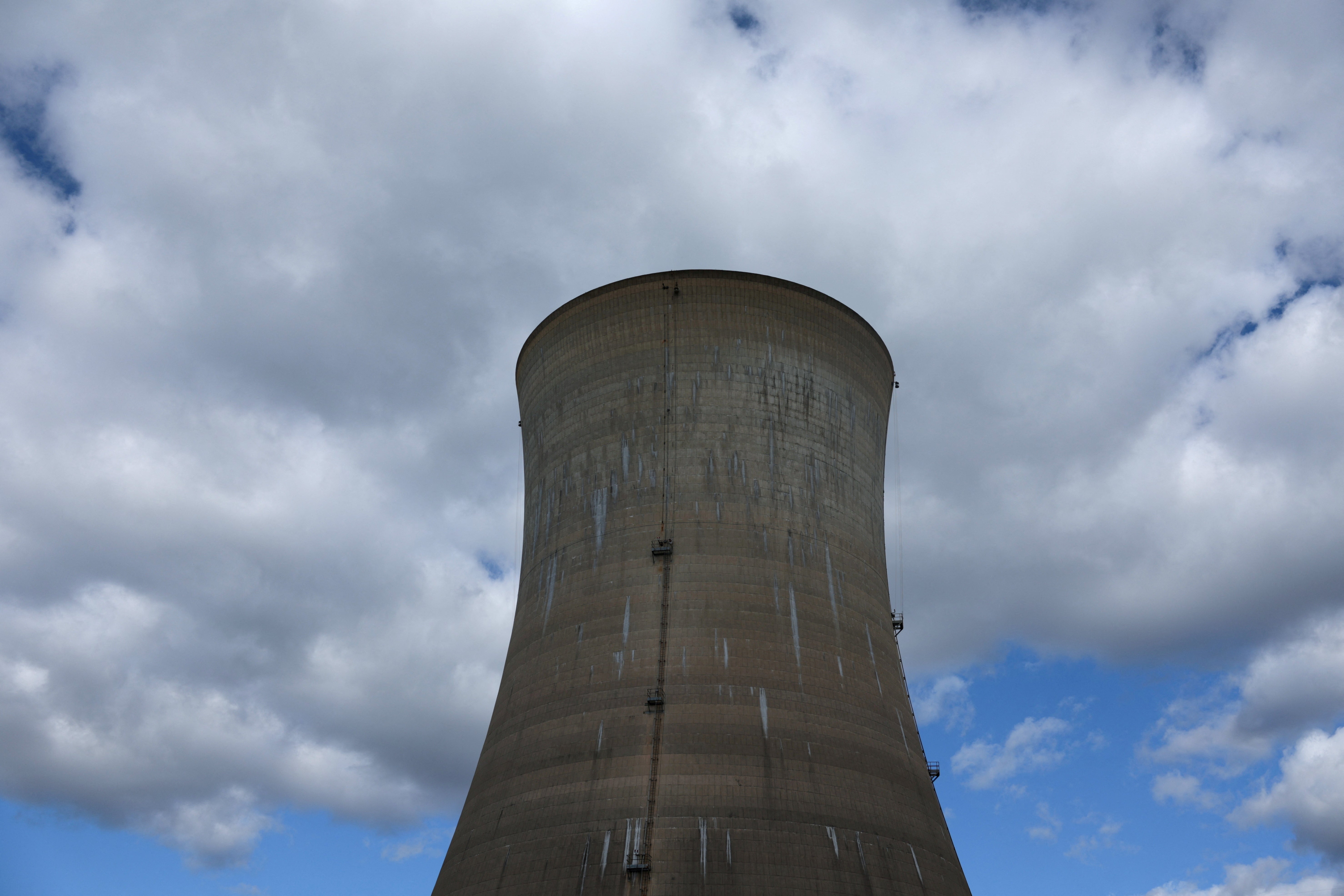 A cooling tower is seen at the Three Mile Island Nuclear power plant in Pennsylvania last October. Clean energy investment could help humanity avoid collapse, a new paper states