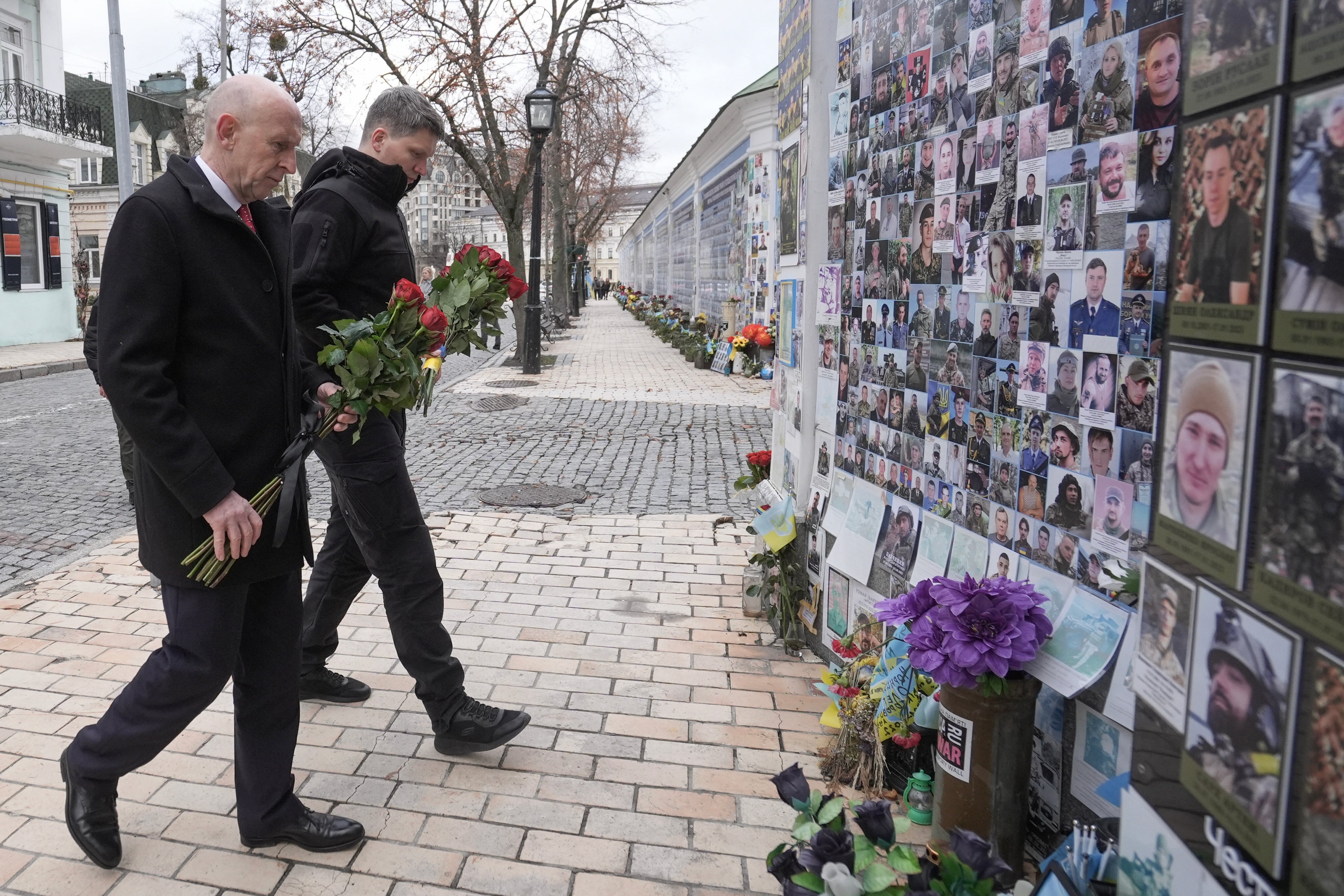 Britain’s defence secretary John Healey lays flowers with deputy minister of defence of Ukraine for European Integration