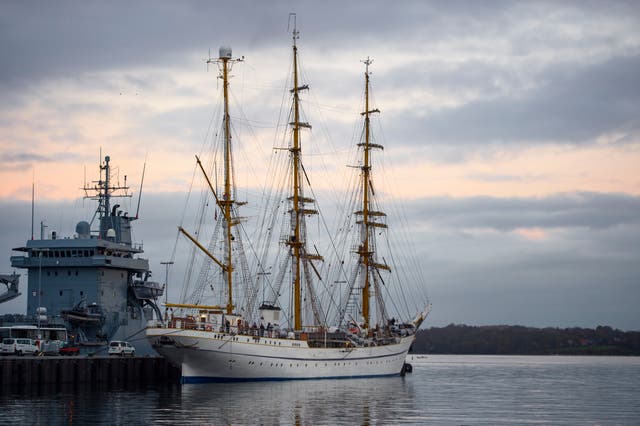 <p>File. A ship is seen docked at the Kiel naval base on the Baltic Sea in Germany</p>