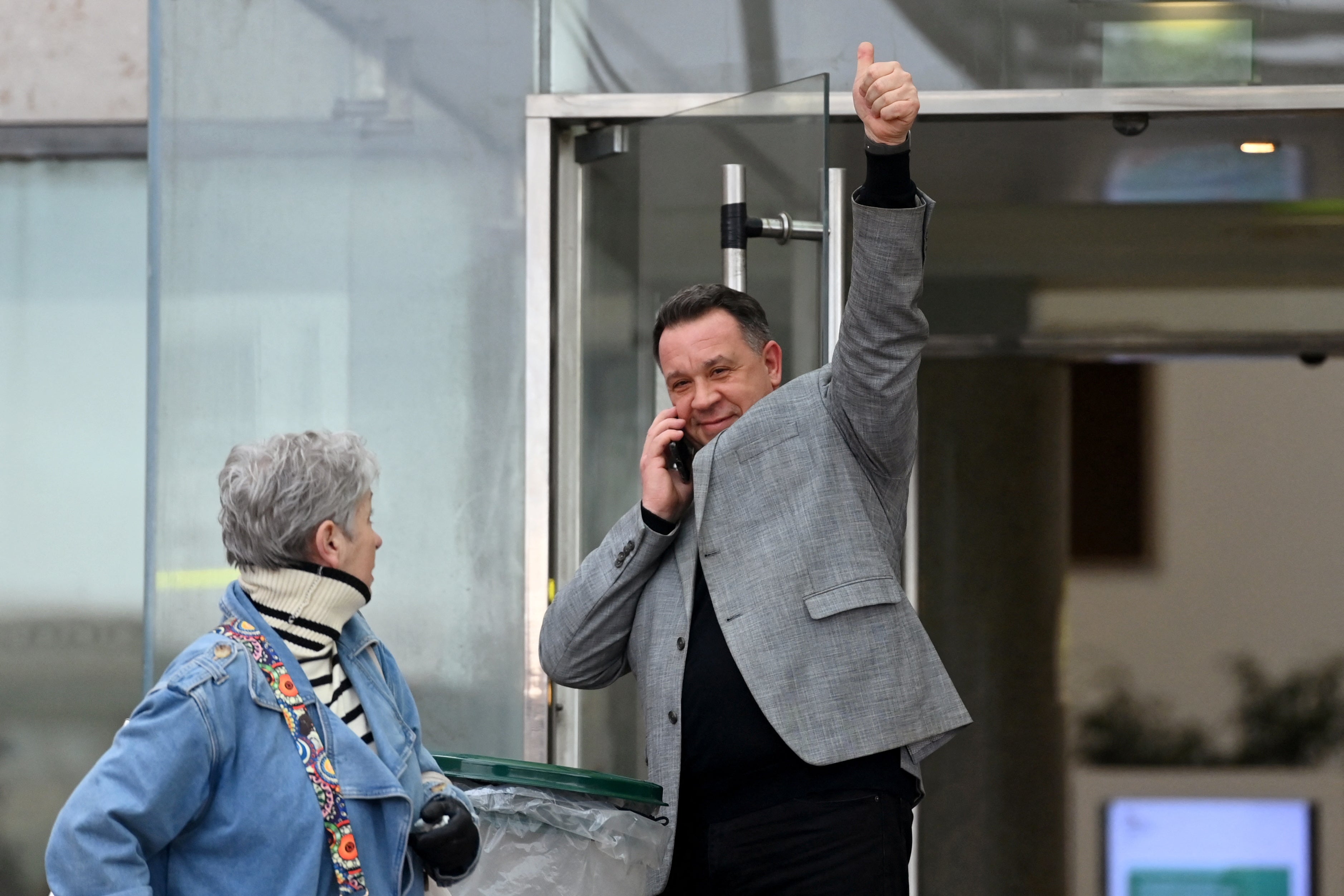 David, one of the two sons of Frenchwoman Gisèle Pelicot, gives a thumbs up outside the courtroom