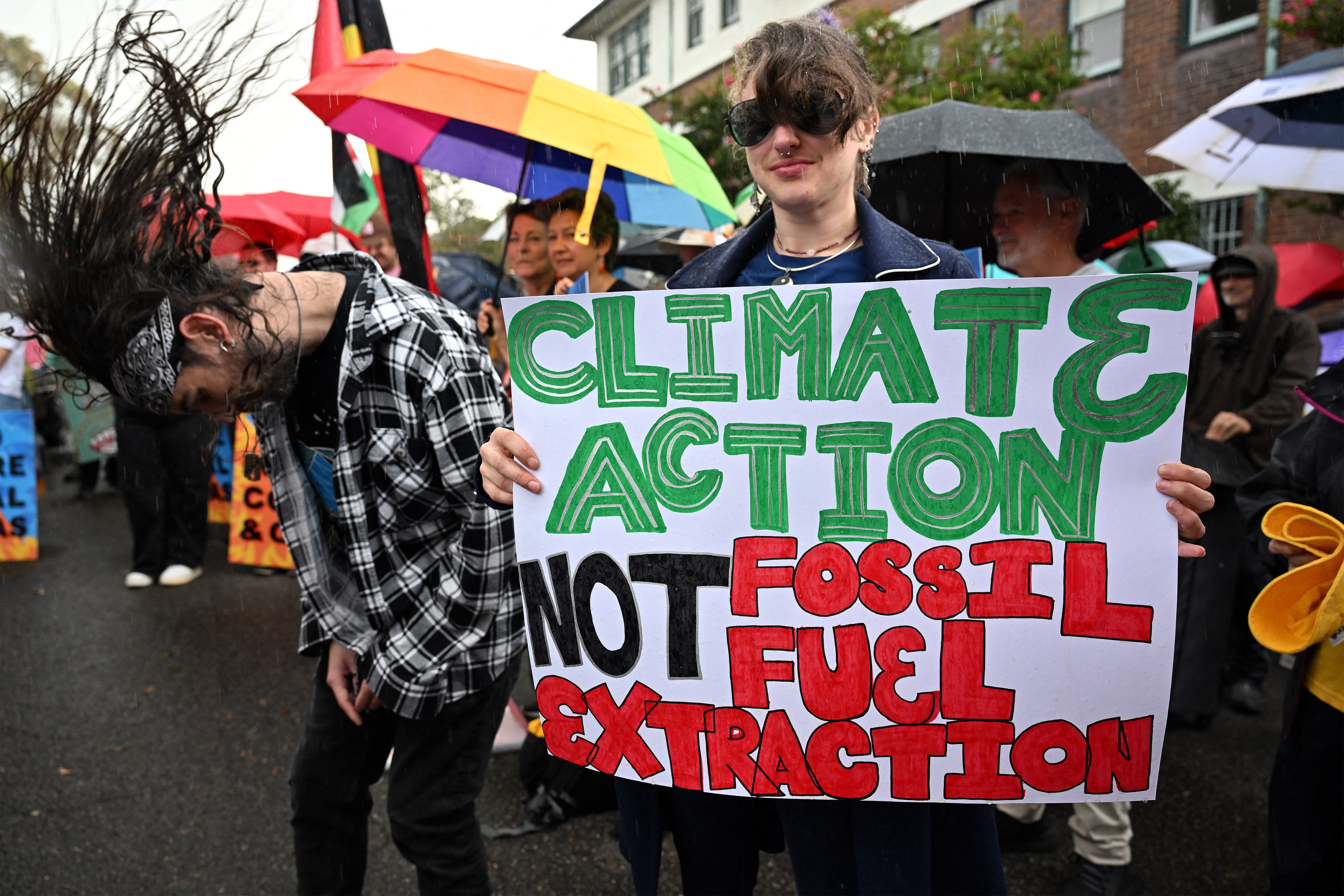 Activists hold a protest rally demanding the Anthony Albanese government halt further approvals of coal and gas projects, in Sydney in May