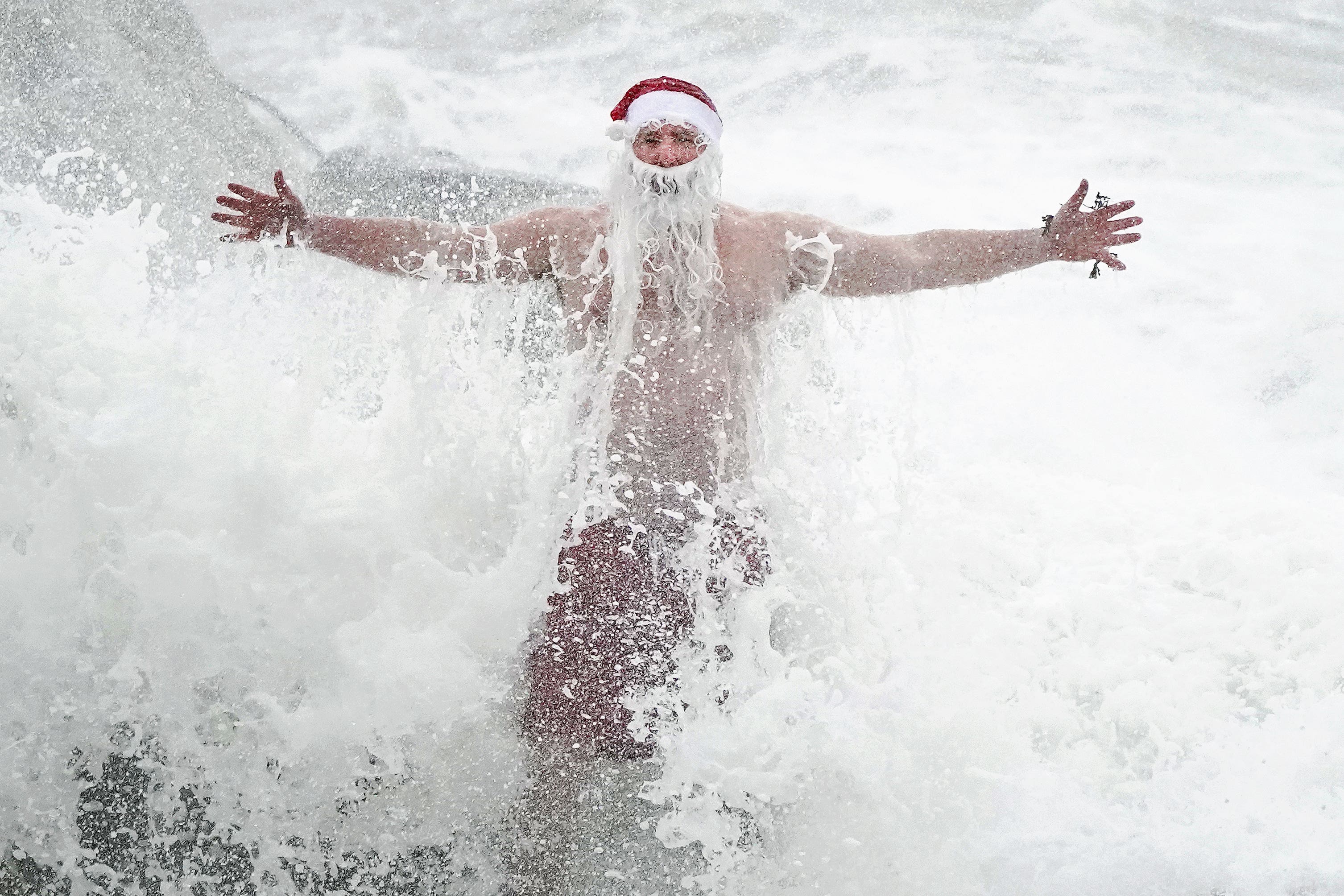 Santa swims and surfing events are under threat as a result of sewage spills, an MP suggested (Niall Carson/PA)