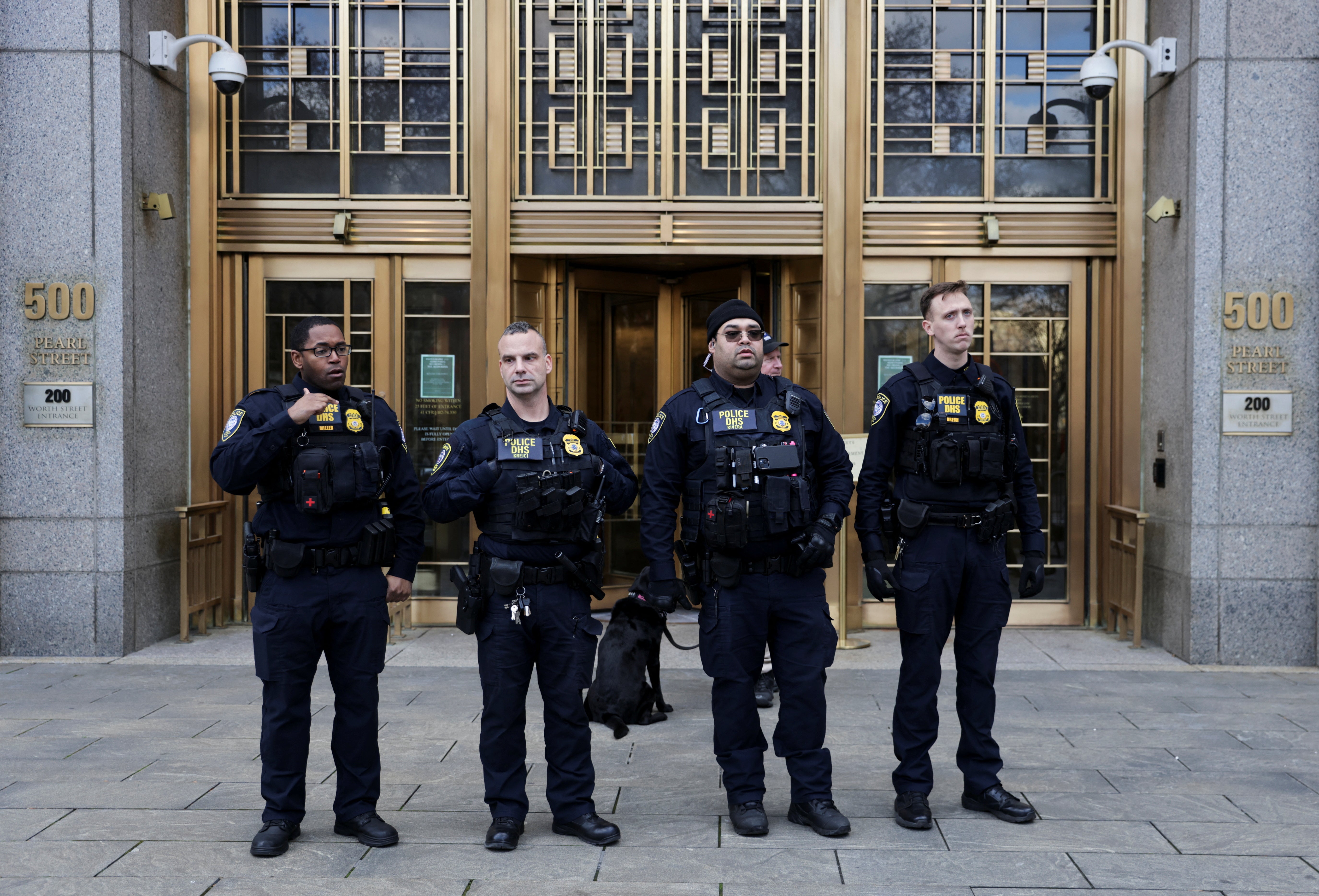 Officers stand outside the federal courthouse in Manhattan, where Luigi Mangioni is set to be arraigned on charges including murder