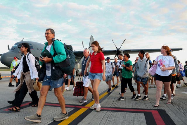 <p>File. Australians stranded in Vanuatu following a powerful earthquake on 17 December disembark from a Royal Australian Air Force plane at Brisbane International Airport in Brisbane, Australia, Thursday, 19 December 2024</p>