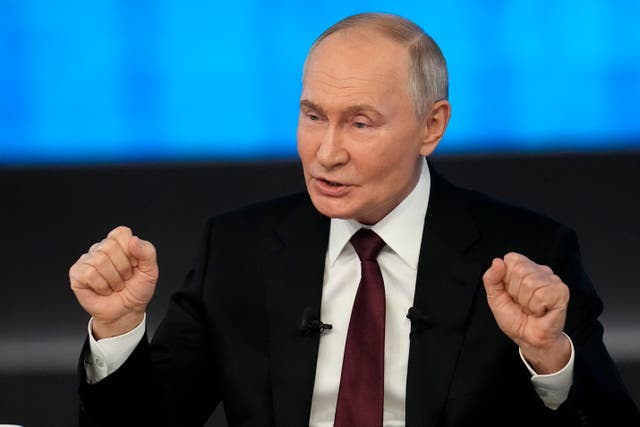 <p>Russian president Vladimir Putin gestures while speaking during his annual news conference</p>