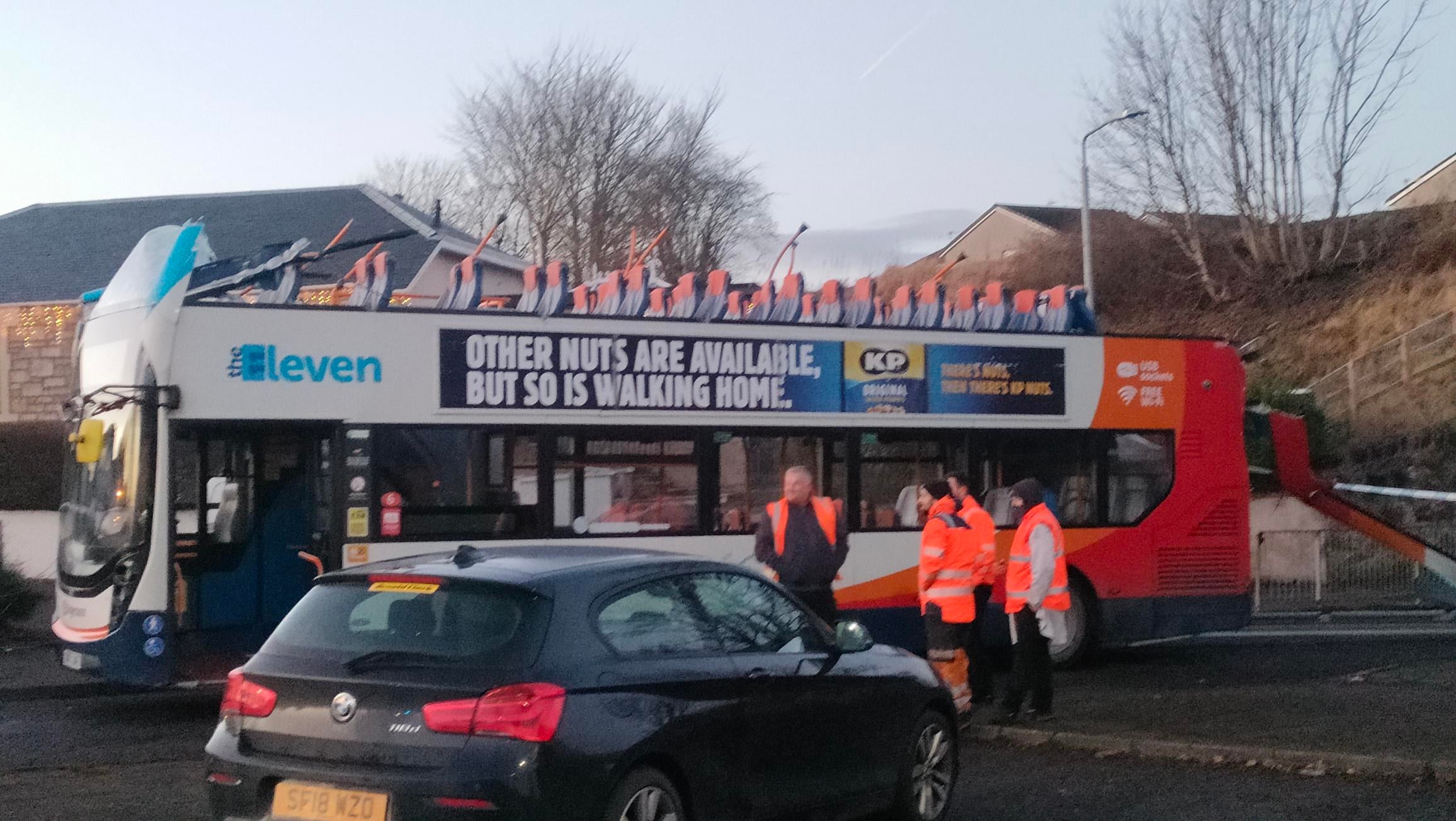 The roof of the double decker bus was ripped off after it crashed into a bridge