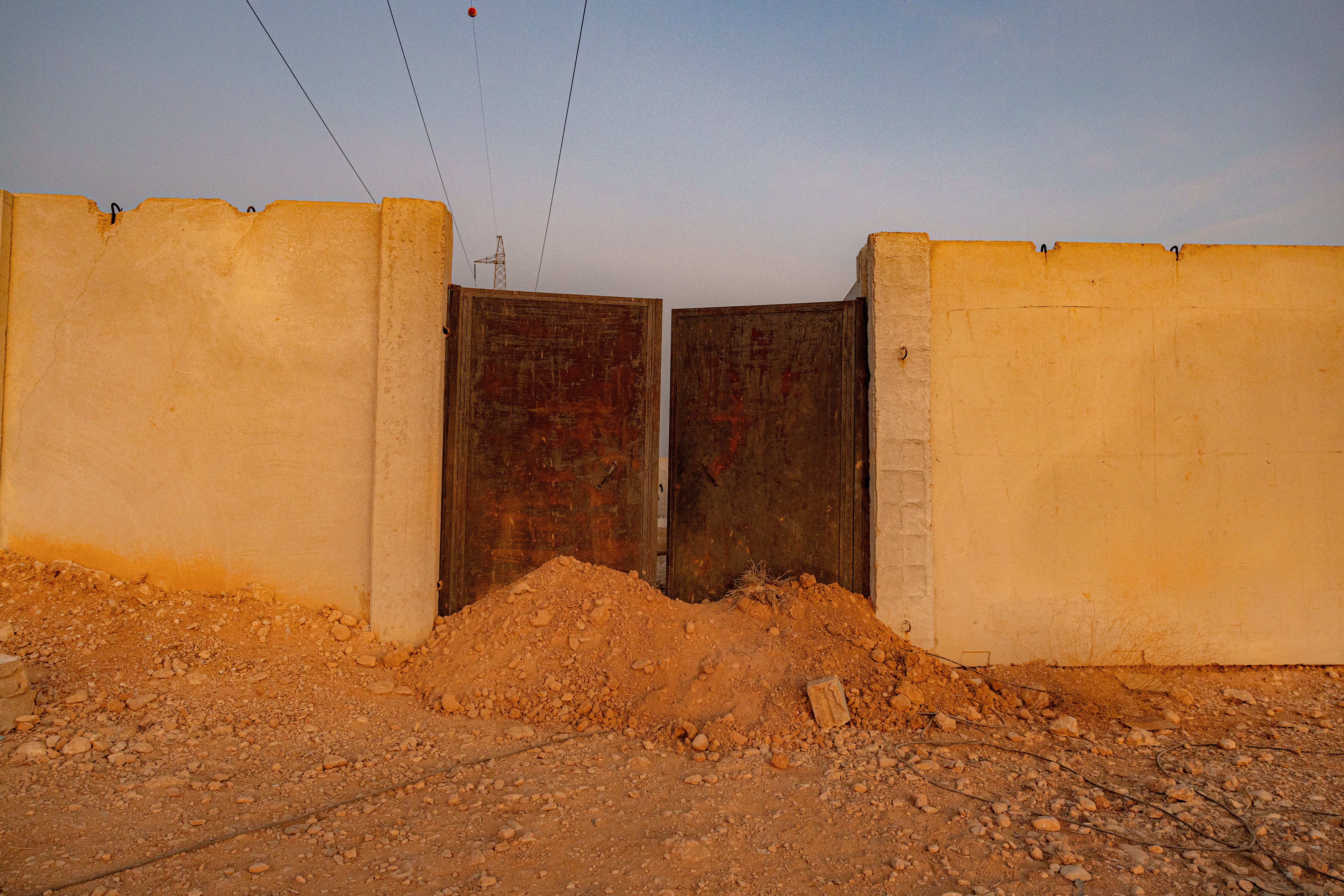 The gates to the mass grave in Qutayfah which were erected at some point after 2016