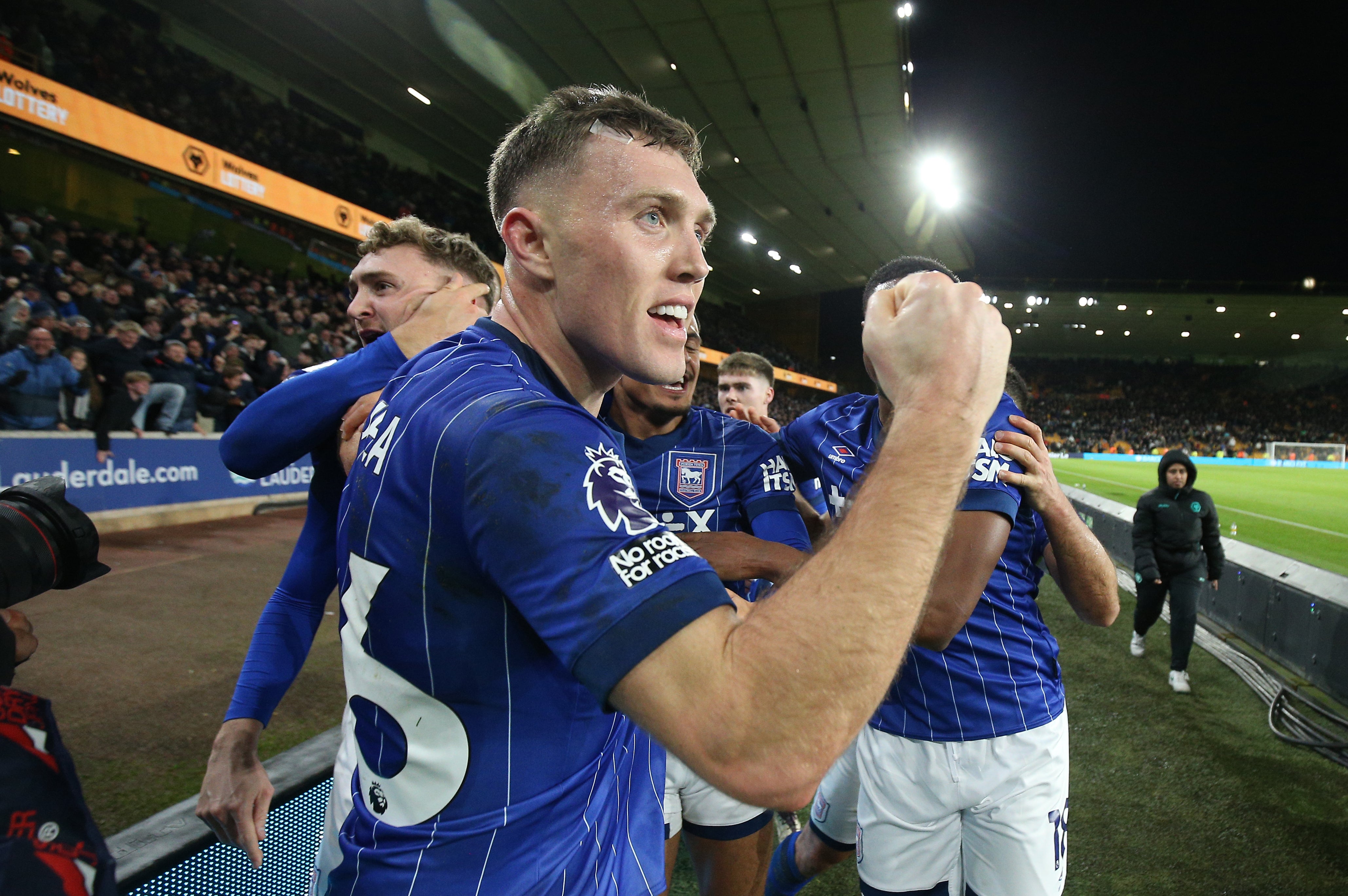 The battling defender celebrates after teammate Jack Taylor scores the winning goal at Wolves