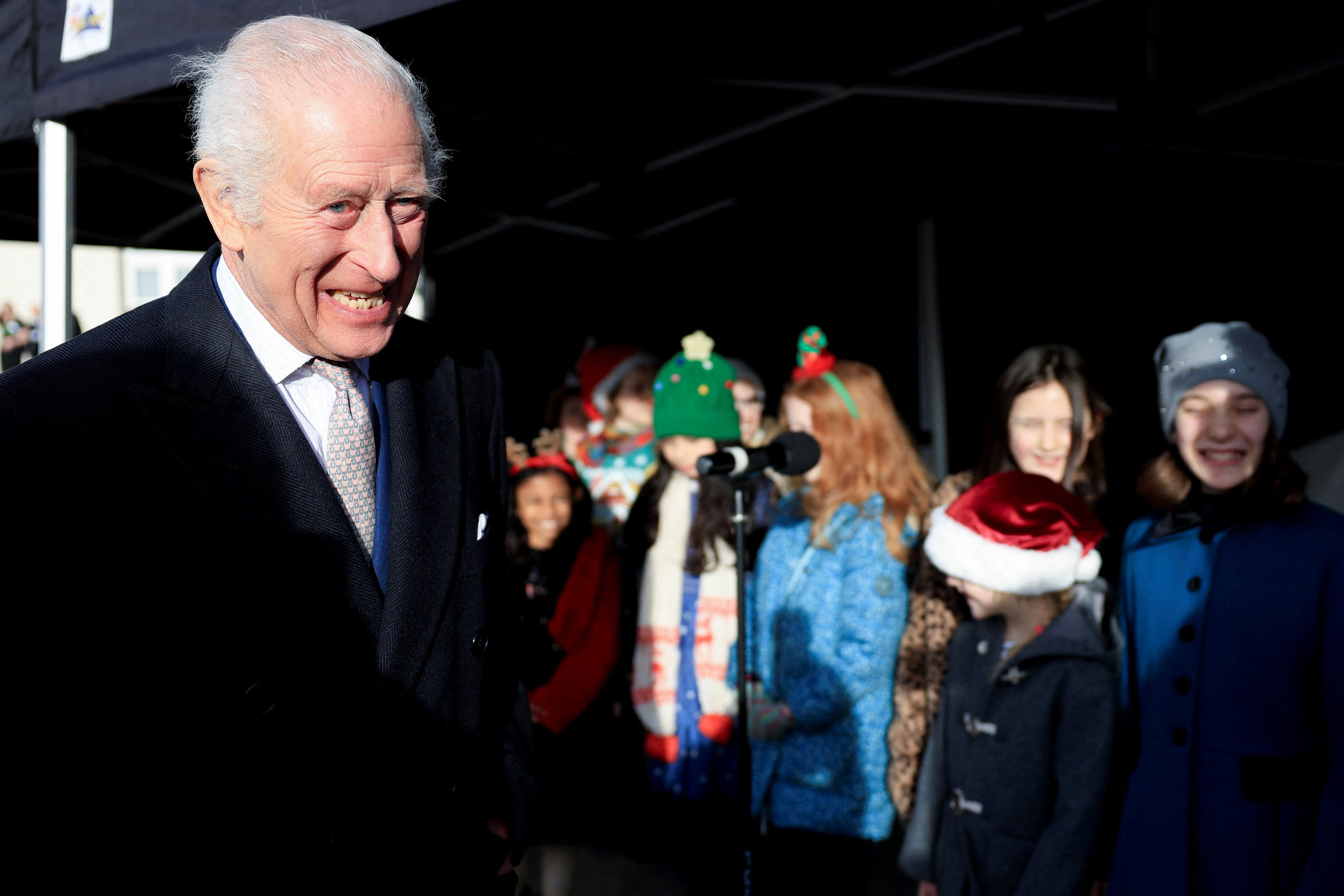 The King with members of a children’s at a reception at Waltham Forest Town Hall (Mina Kim/PA)