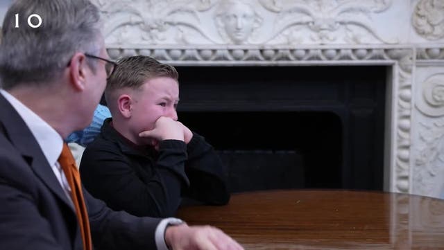 <p>Moment Starmer comforts emotional child after surprise Christmas call to military families.</p>