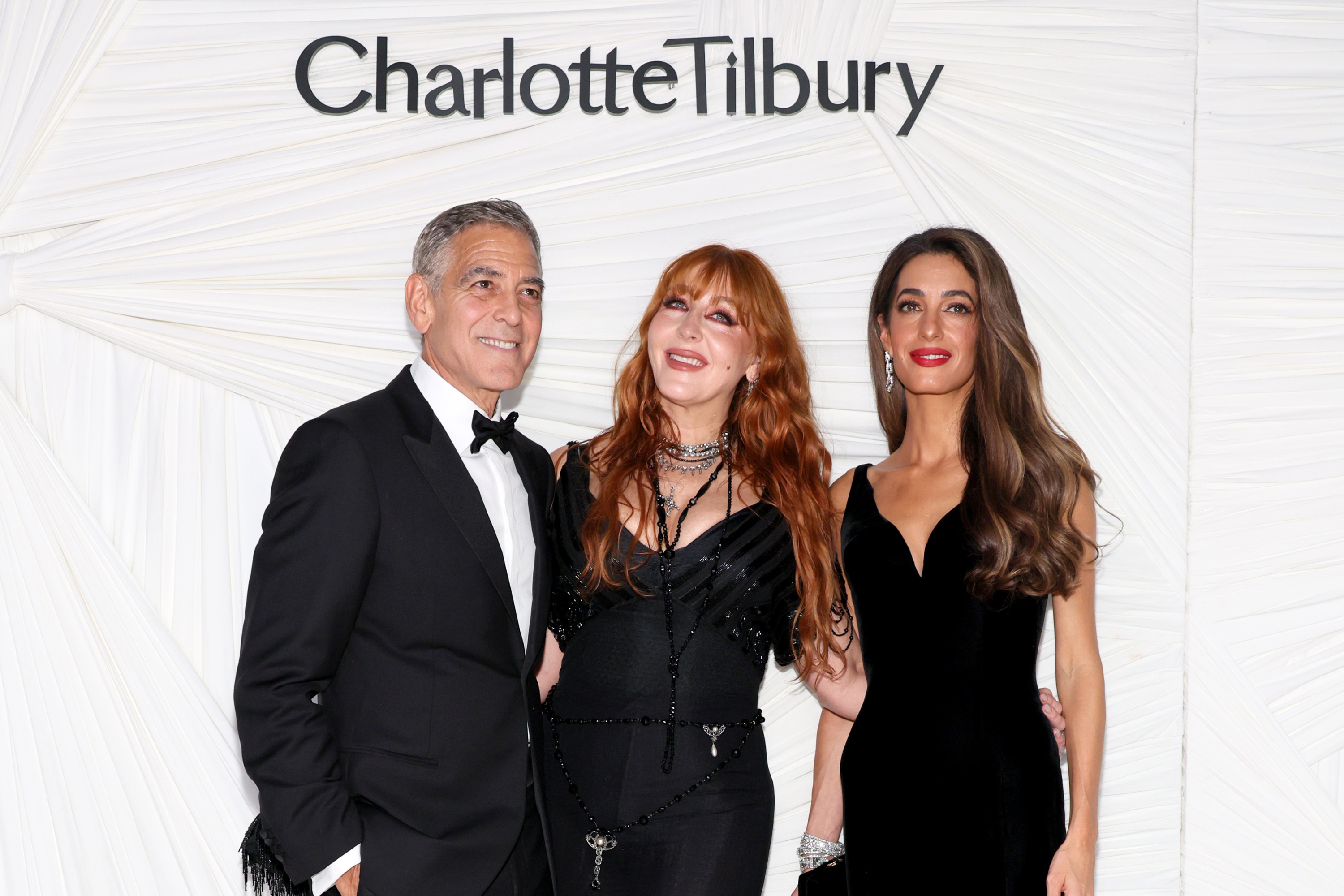 Tilbury (middle) accompanied by George (left) and Amal Clooney (right)