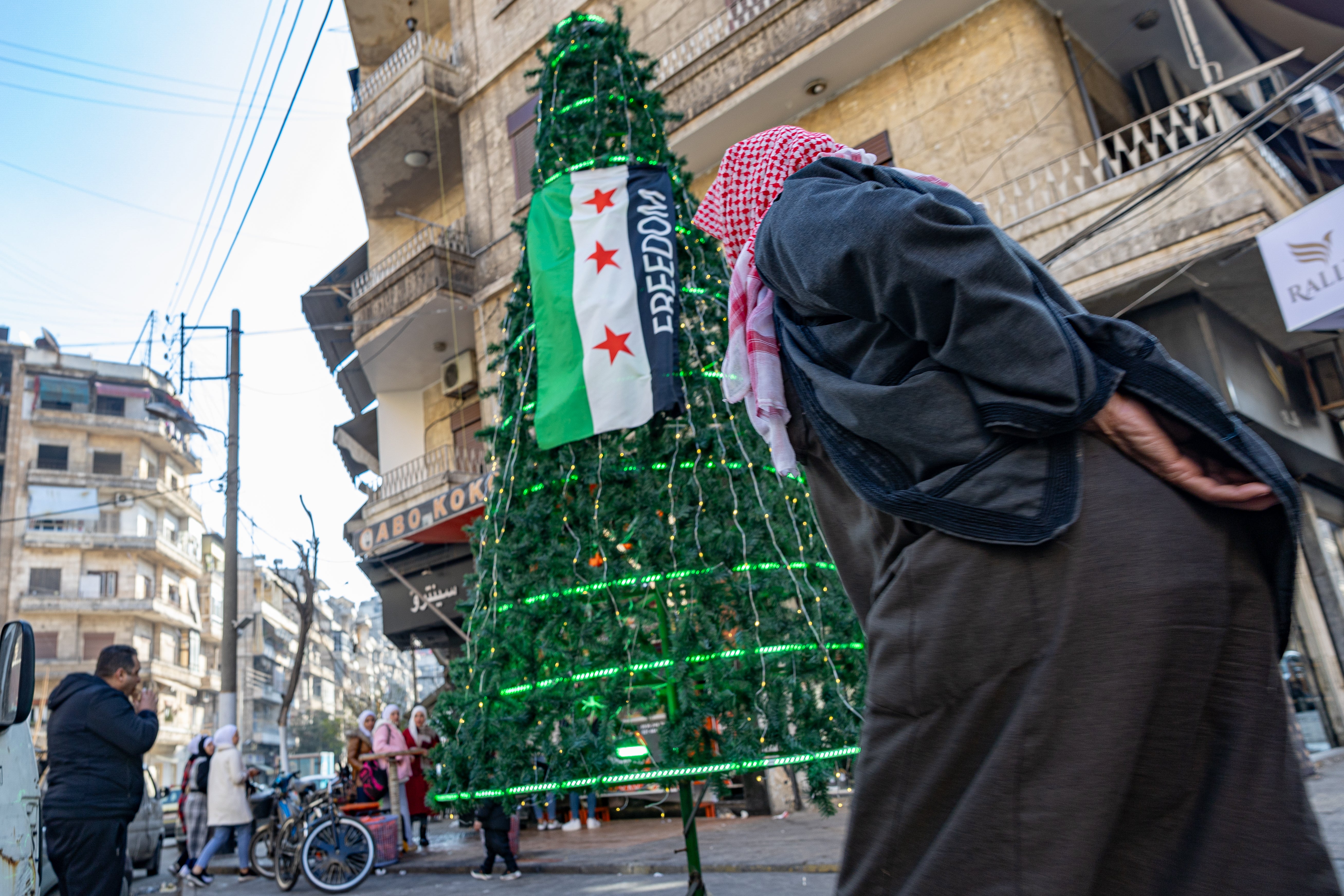 <p>The Christmas tree in Aleppo, attacked in the immediate aftermath of the ouster of Assad, is restored in the centre of Syria’s second city</p>