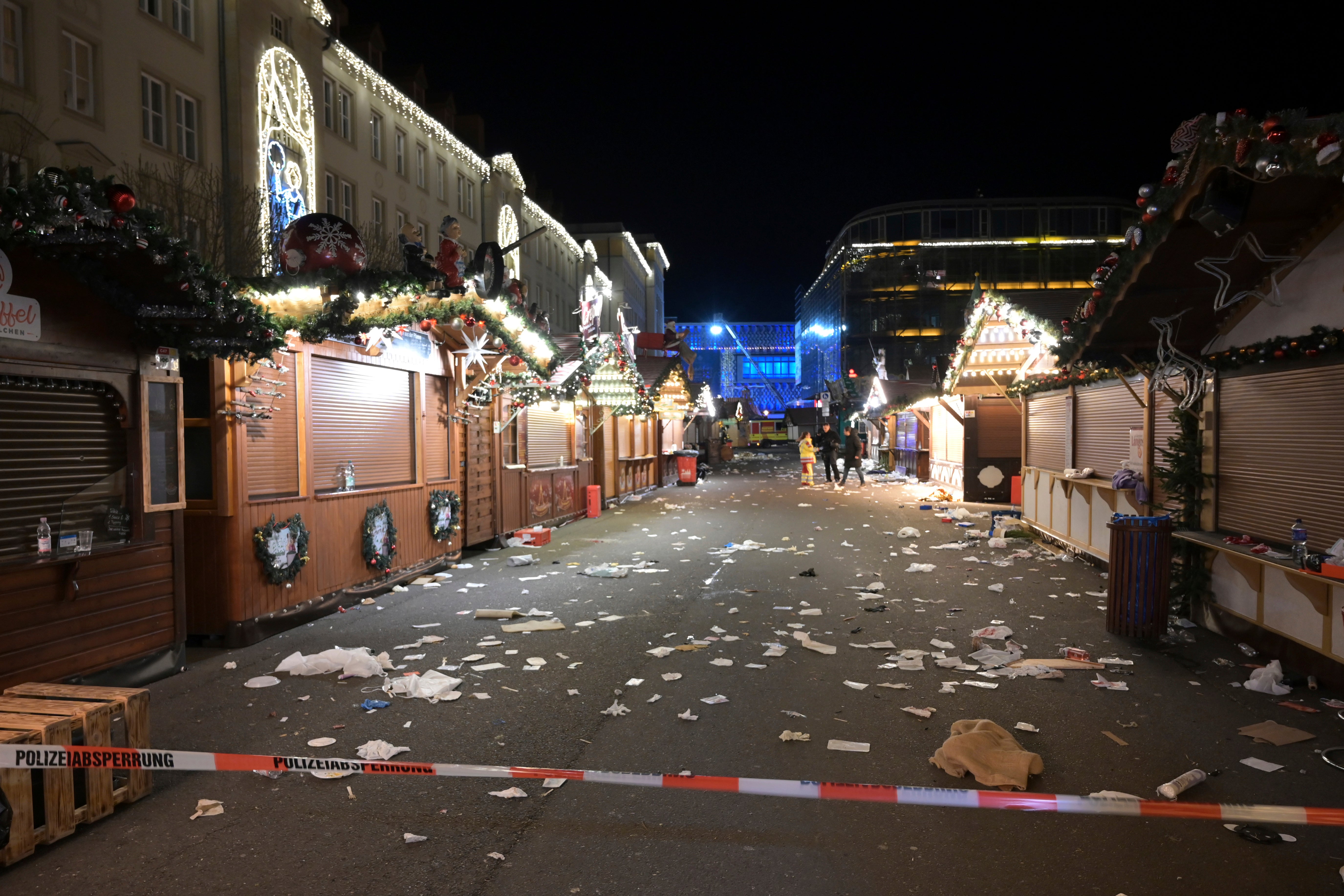 Debris litters the floor of the Christmas market following the attack