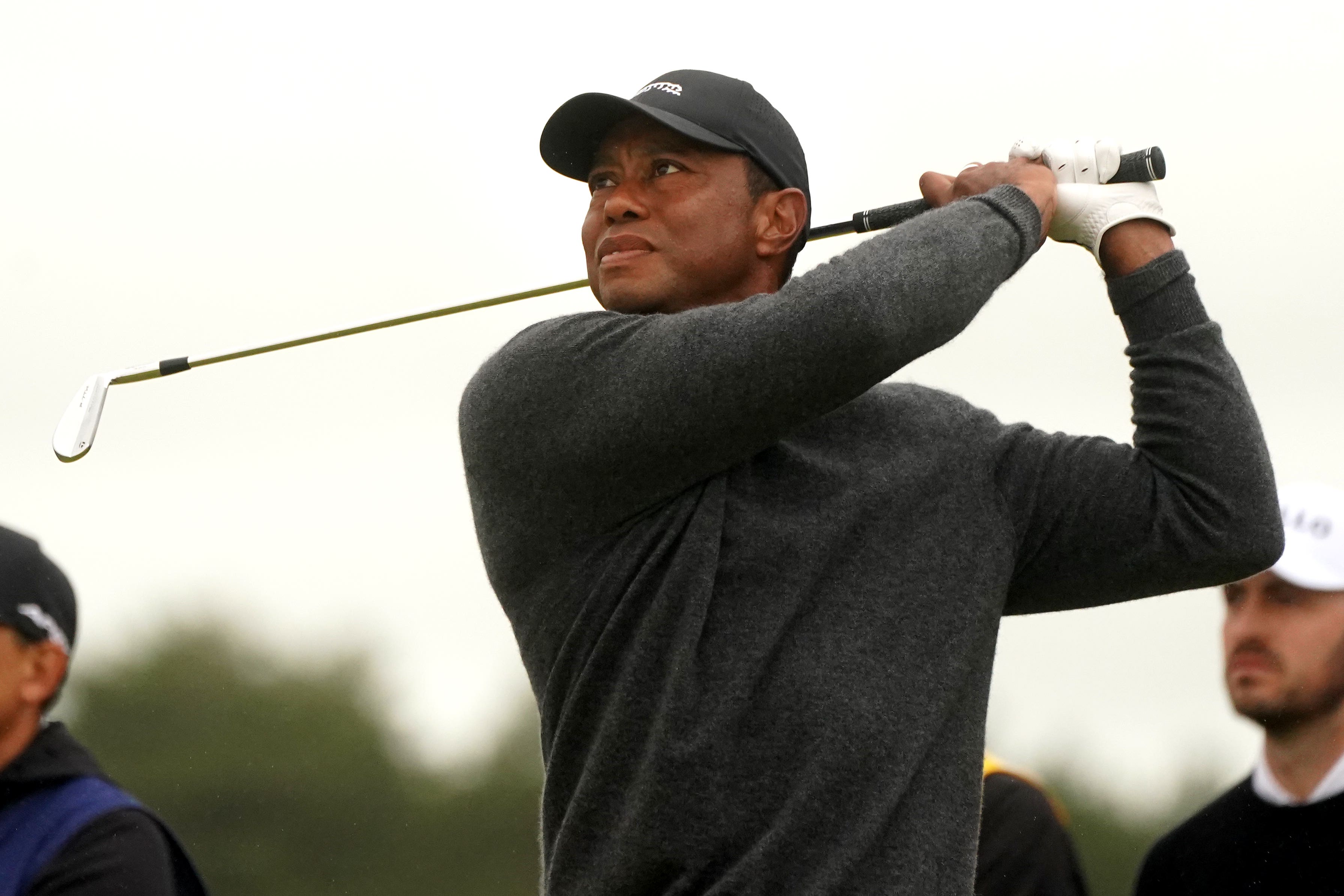 Tiger Woods tees off (PA)