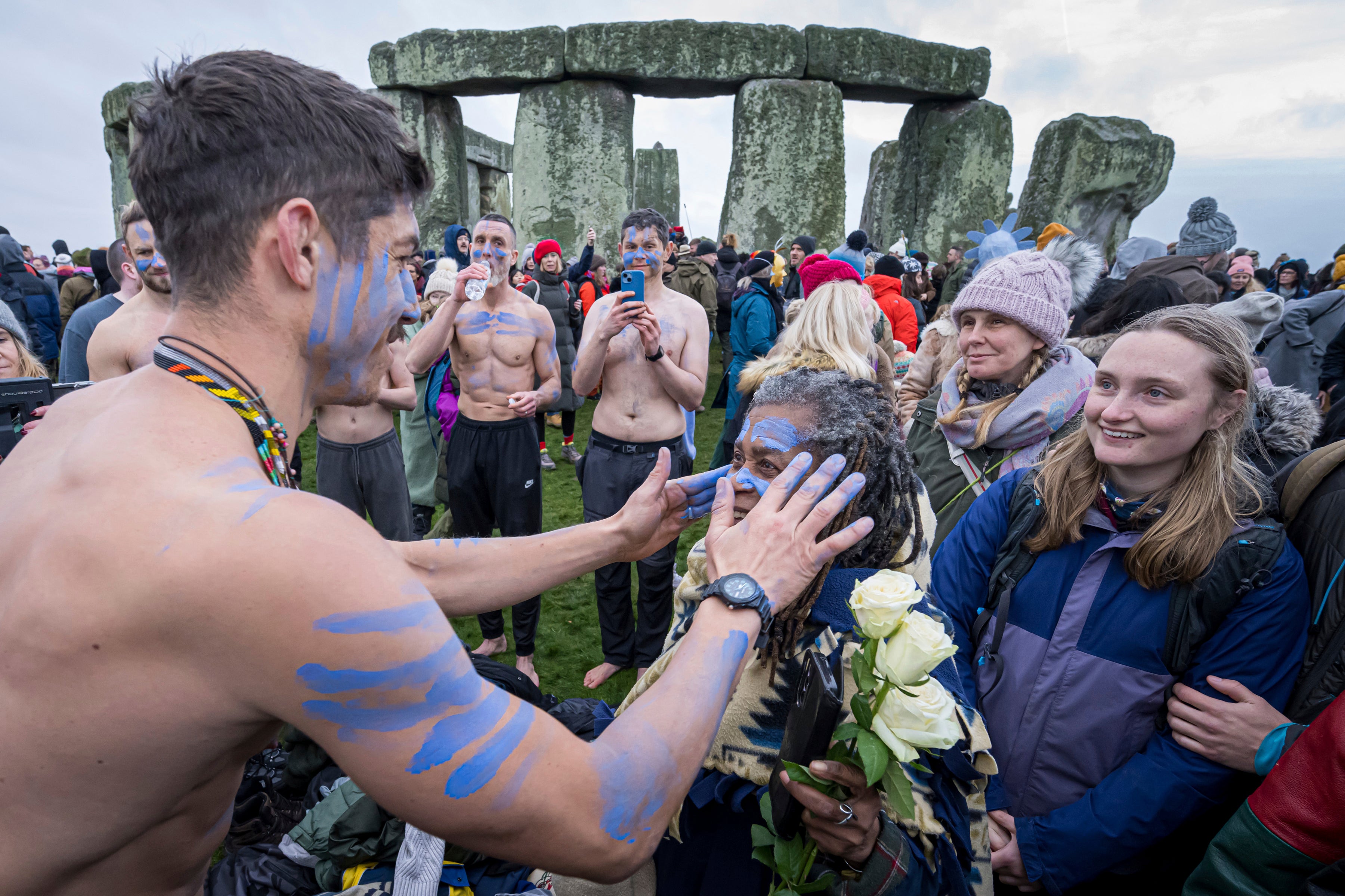 Faces are painted to mark the solstice