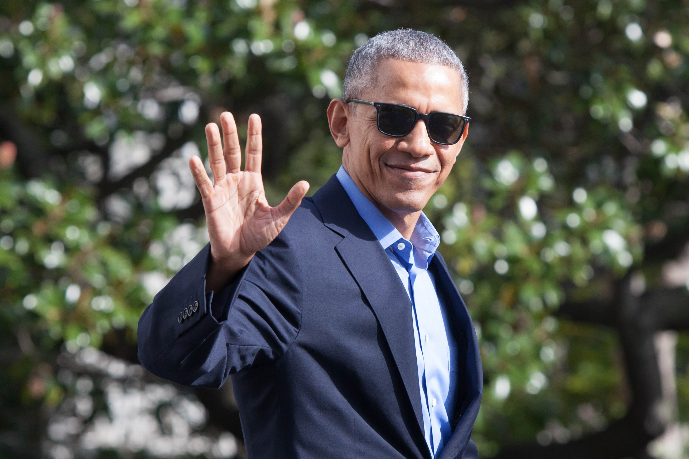 President Barack Obama waves as he exits The White House before boarding Marine One on November 6, 2016 in Washington, D.C.