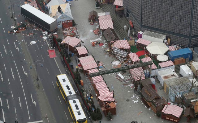 <p>In this 2016 file photo the trailer of a truck stands beside destroyed huts following an attack on a Christmas market in Berlin, Germany</p>