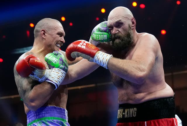 <p>Oleksandr Usyk, left, outpoints Tyson Fury for the second time this year </p>