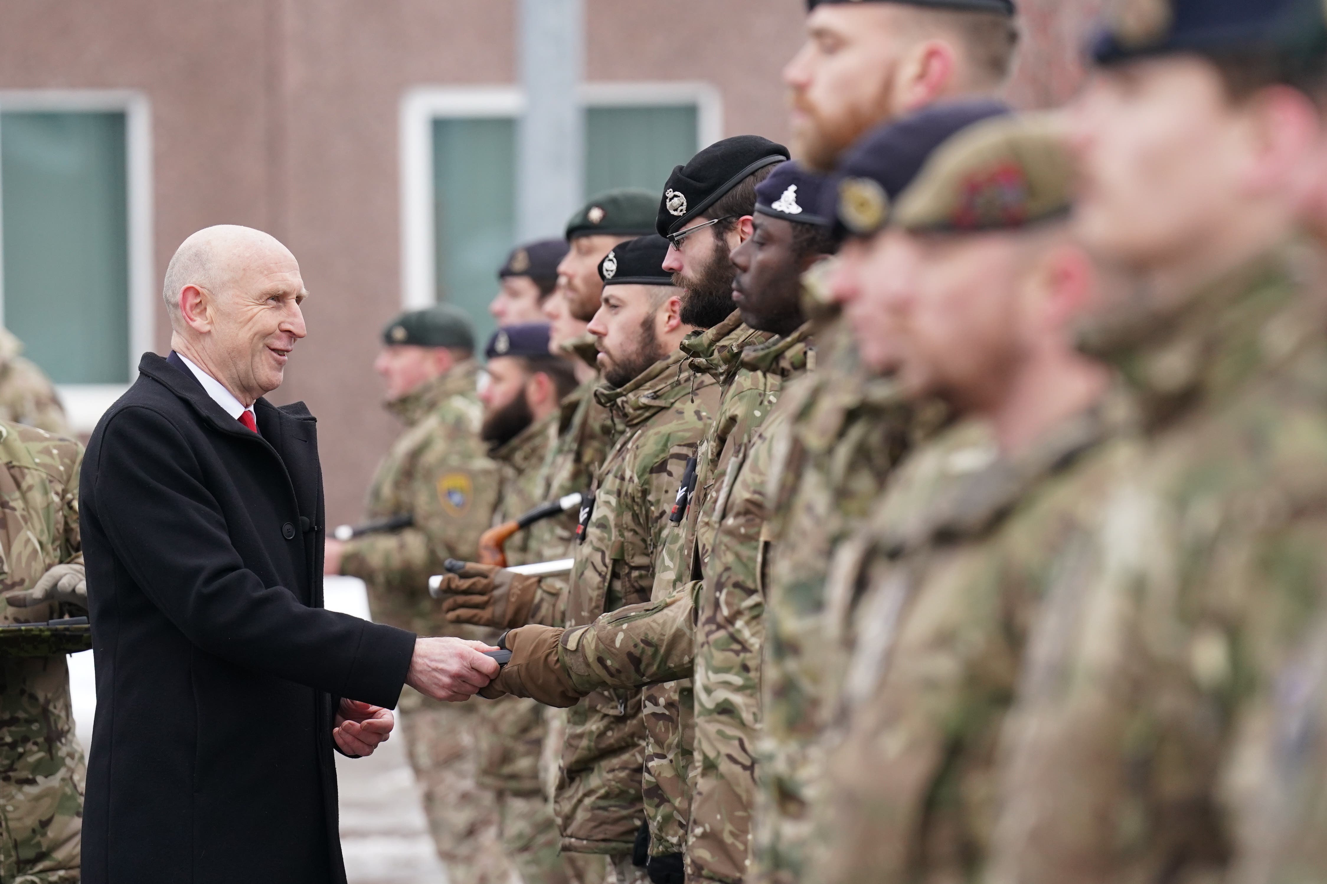 Defence Secretary John Healey giving out Wider Service Medals as he meets British personnel at the Tapa military base in Estonia (Stefan Rousseau/PA)