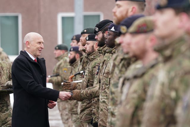 Defence Secretary John Healey giving out Wider Service Medals as he meets British personnel at the Tapa military base in Estonia (Stefan Rousseau/PA)