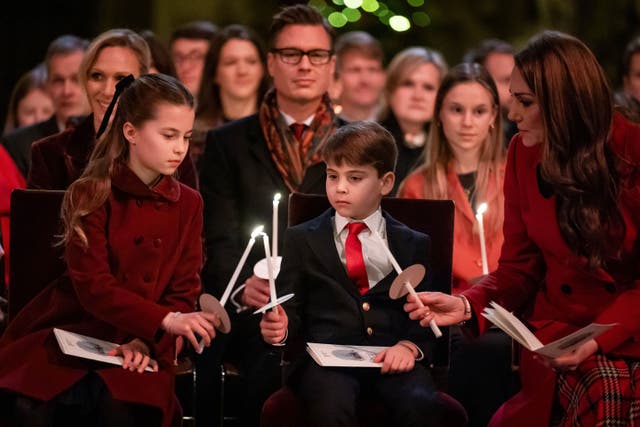 <p>Princess Charlotte, Prince Louis and the Princess of Wales light candles during the Together at Christmas carol service (Aaron Chown/PA)</p>