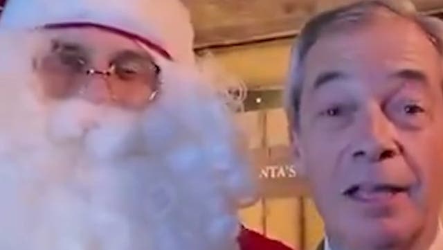 <p>Nigel Farage makes rare trip to Clacton constituency... with Father Christmas</p>