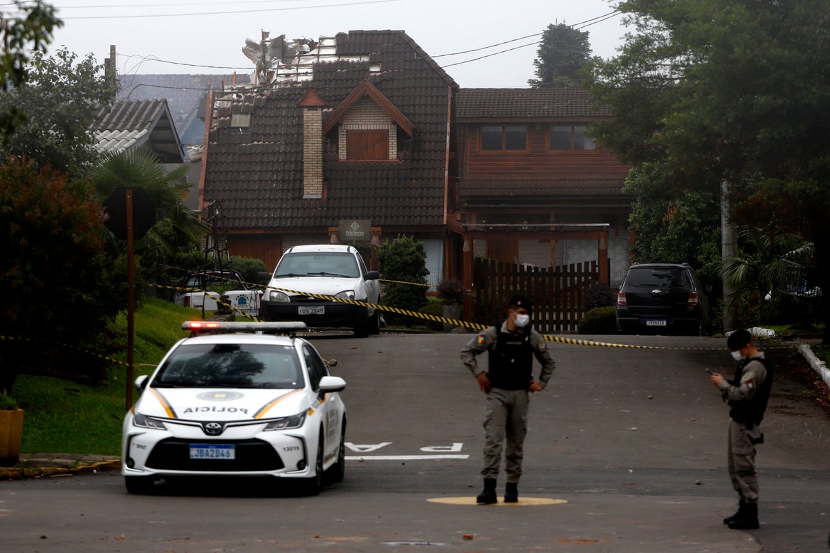 At least 10 are killed as a small plane crashes into a Brazilian town popular with tourists