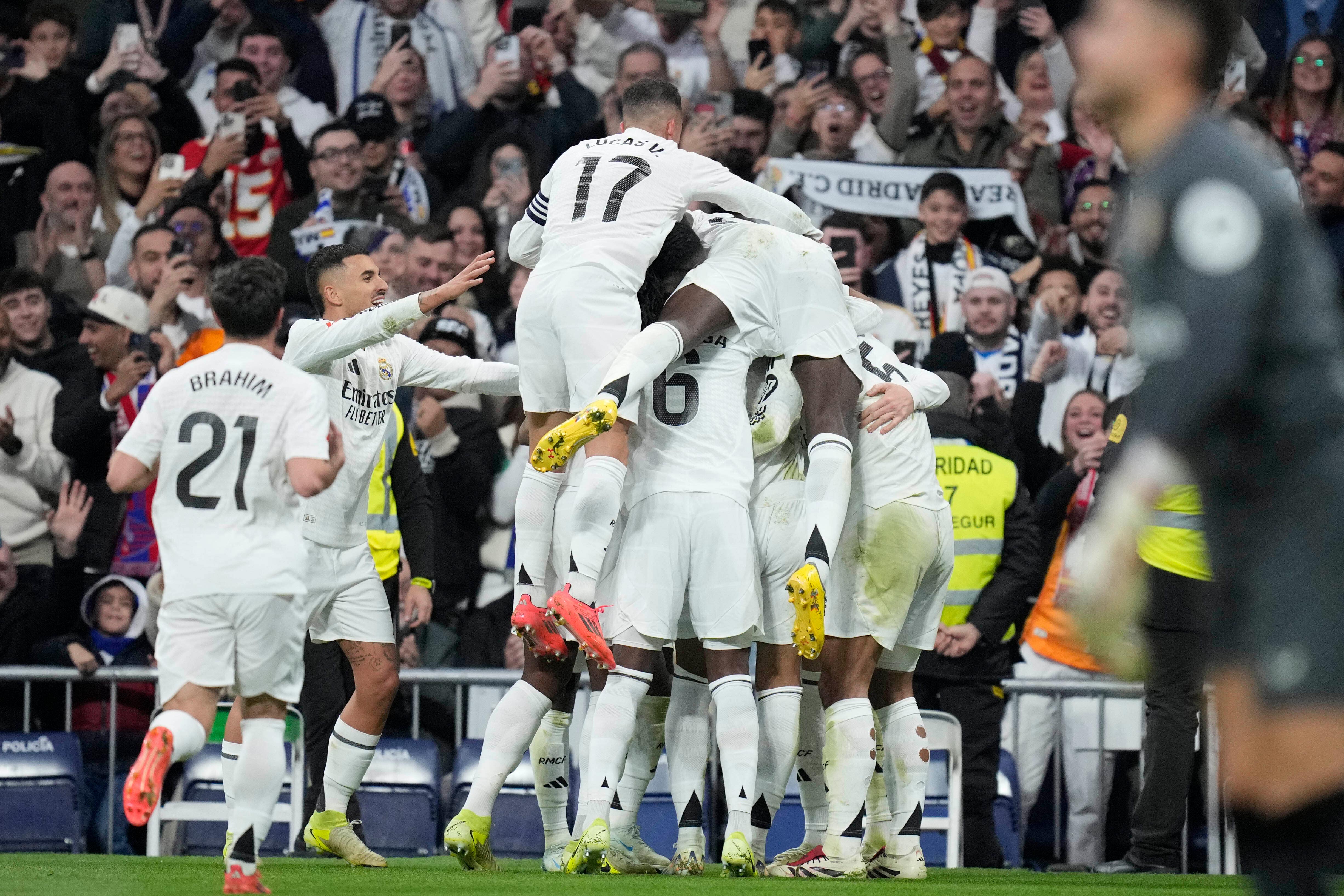 Real Madrid celebrated victory over Sevilla which saw them climb up to second in LaLiga (Bernat Armangue/AP)