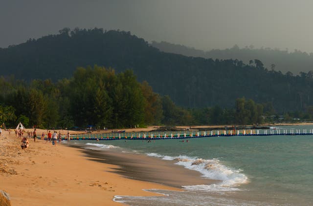 <p>Tourists play on Bang Niang Beach, where tsunami hit 2004, Takuapa district of Phang Nga province</p>