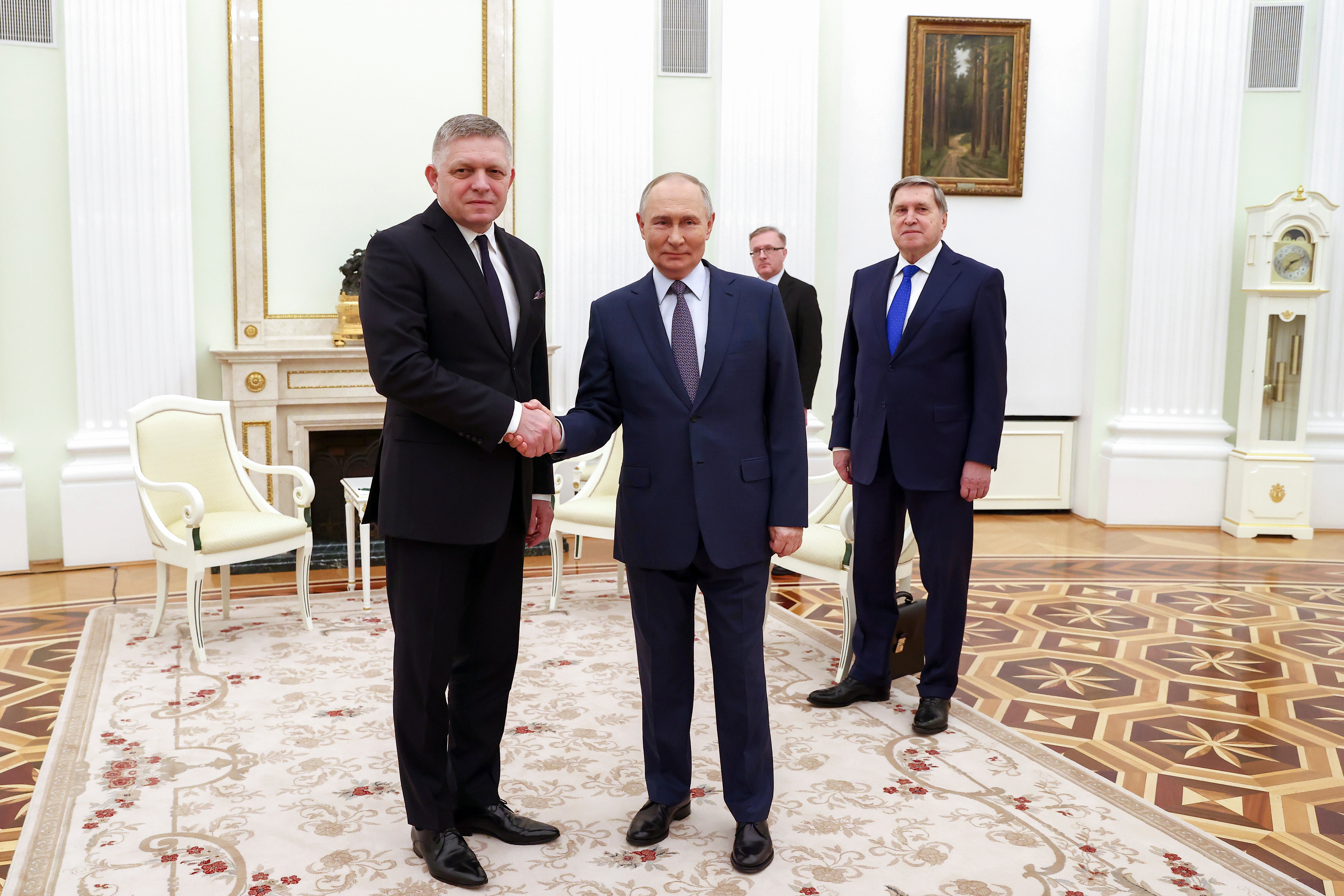 Vladimir Putin and Robert Fico pose for a photo during their meeting at the Kremlin in Moscow,