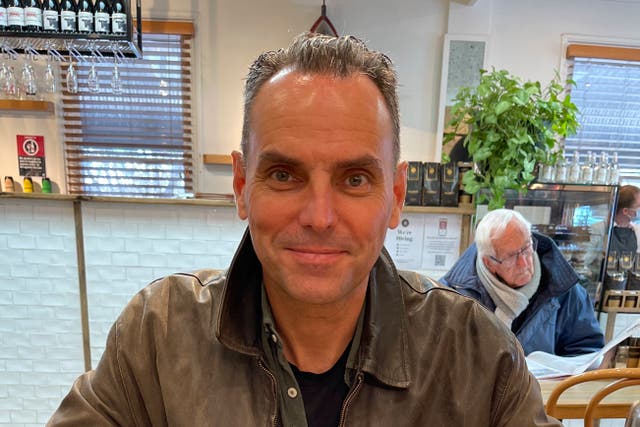 <p>File. In this undated photo provided by Saffrine Duggan, her husband, former US Marine Corps pilot Daniel Duggan, poses for a photo in a restaurant</p>