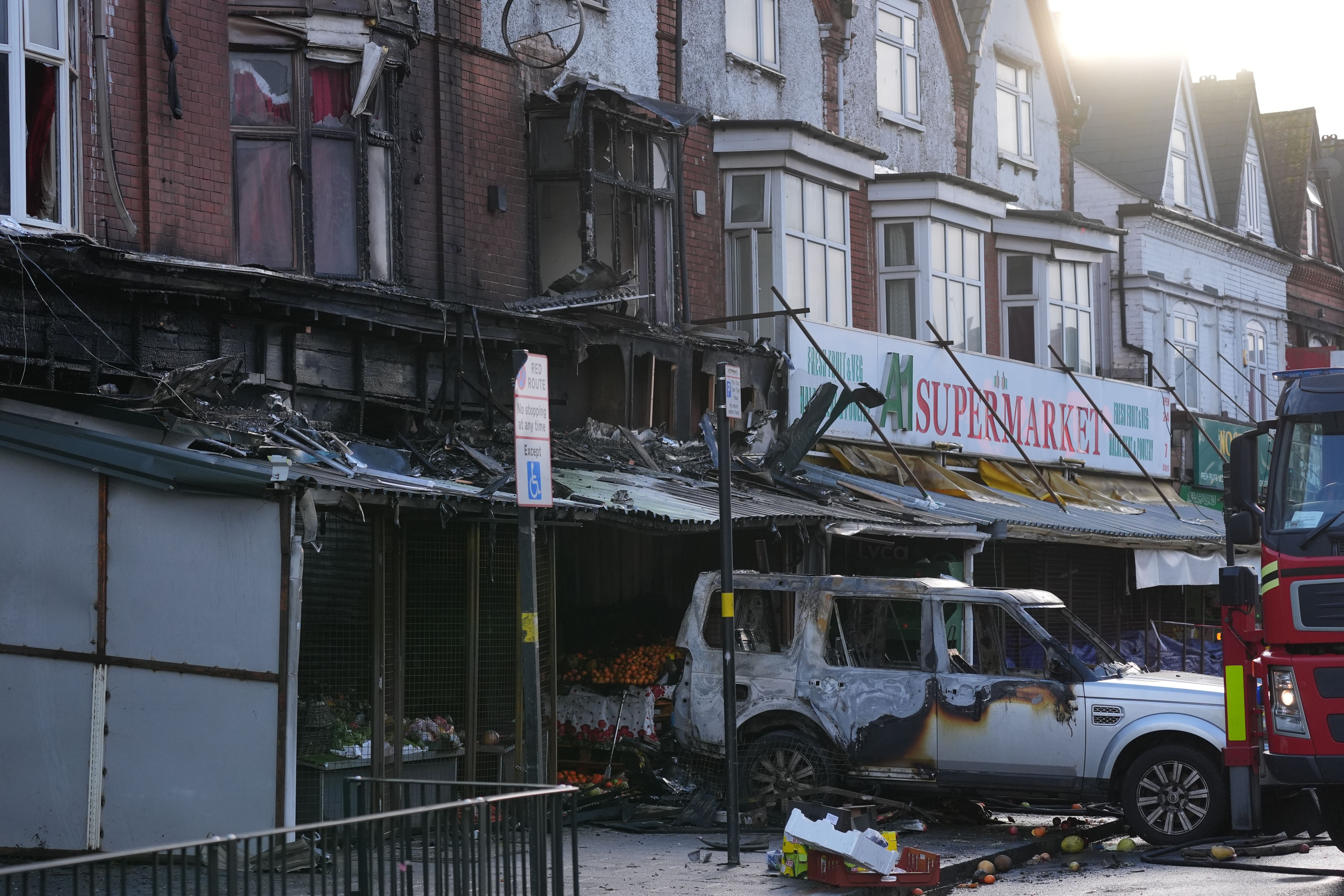 Emergency services at the scene of a fire at a mixed commercial and residential premises on Stratford Road in Sparkhill, Birmingham (Jacob King / PA).