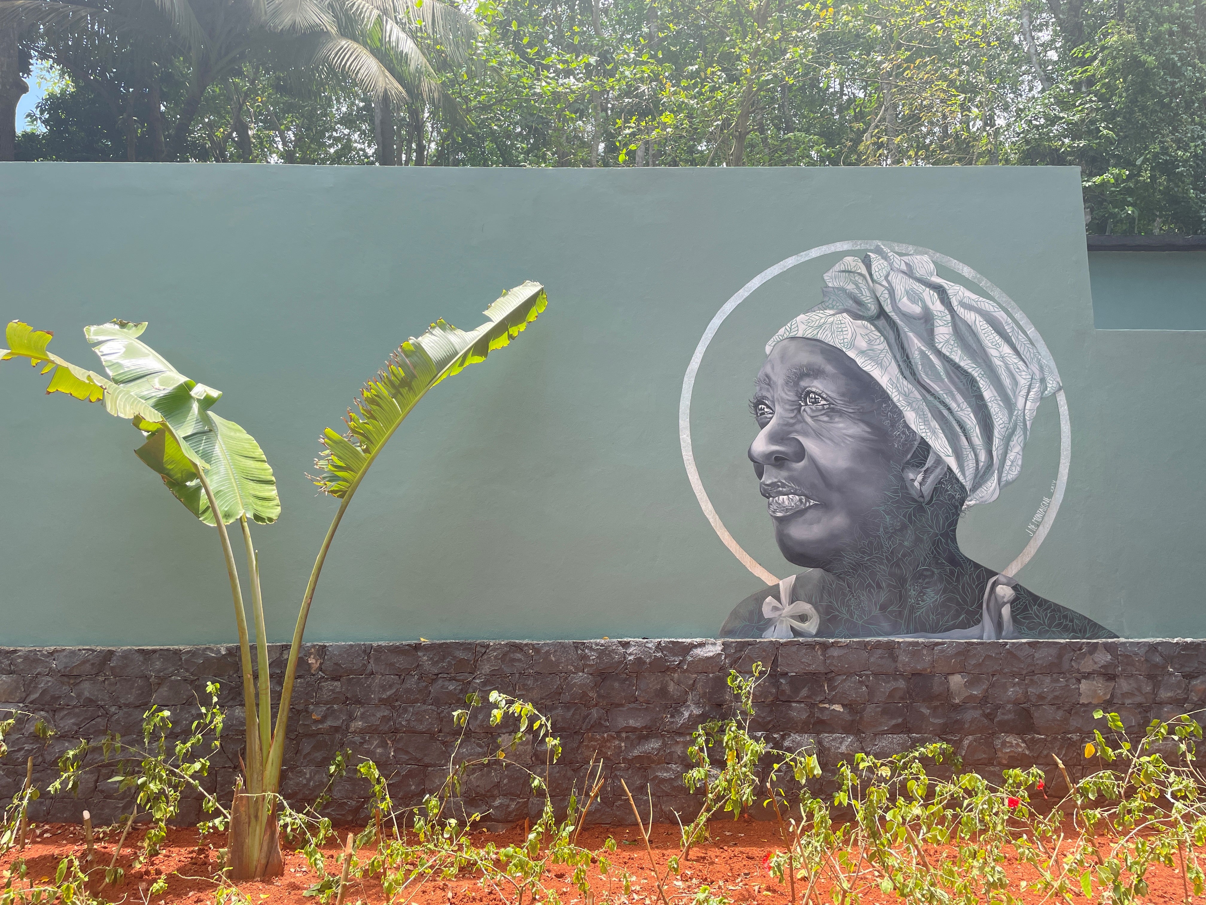 A mural of the local community on a wall at Bom Bom (Sarah Marshall/PA)