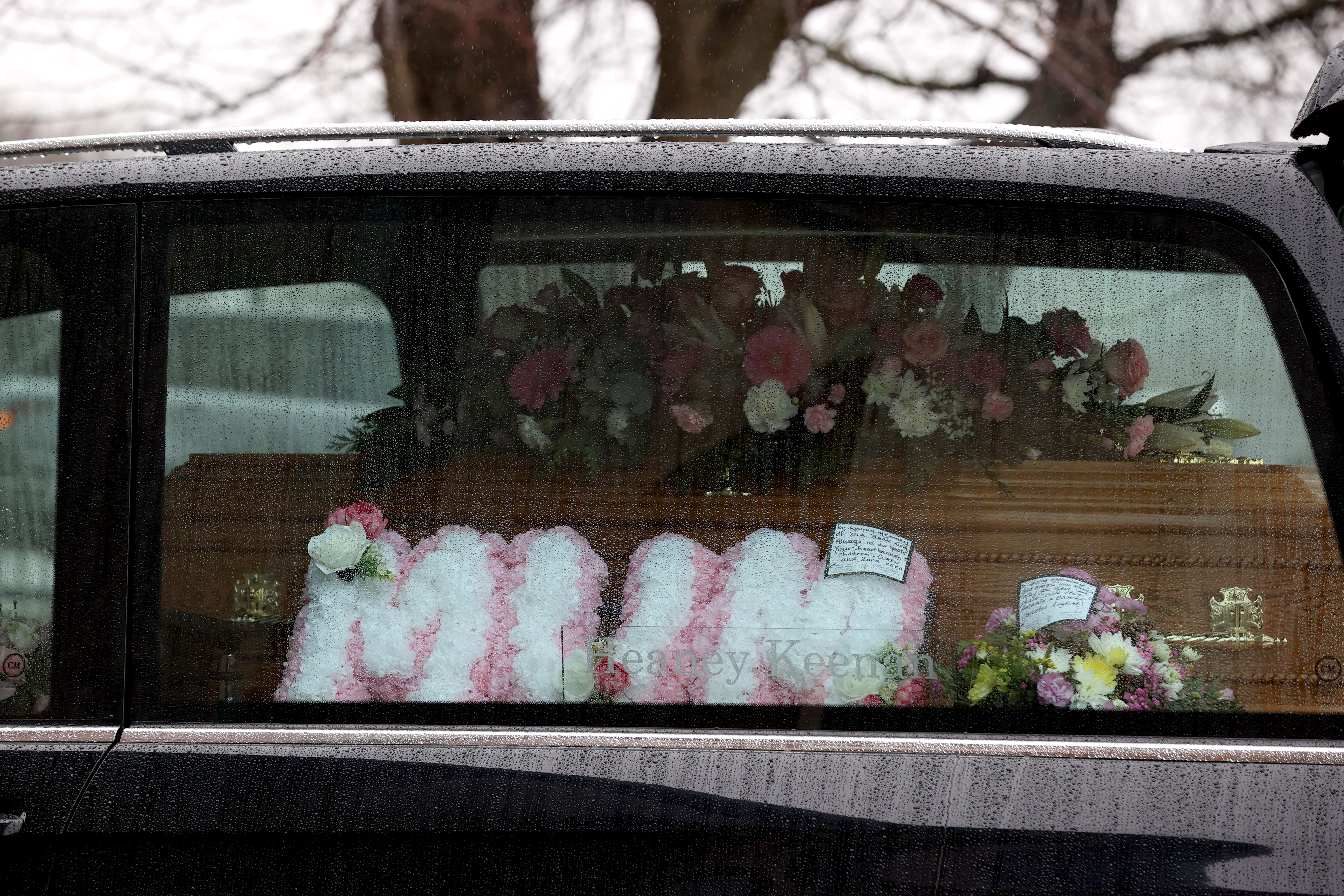 A floral tribute which says ‘Mum’ alongside the coffin in the hearse for Karen Cummings’ funeral (Liam McBurney/PA)