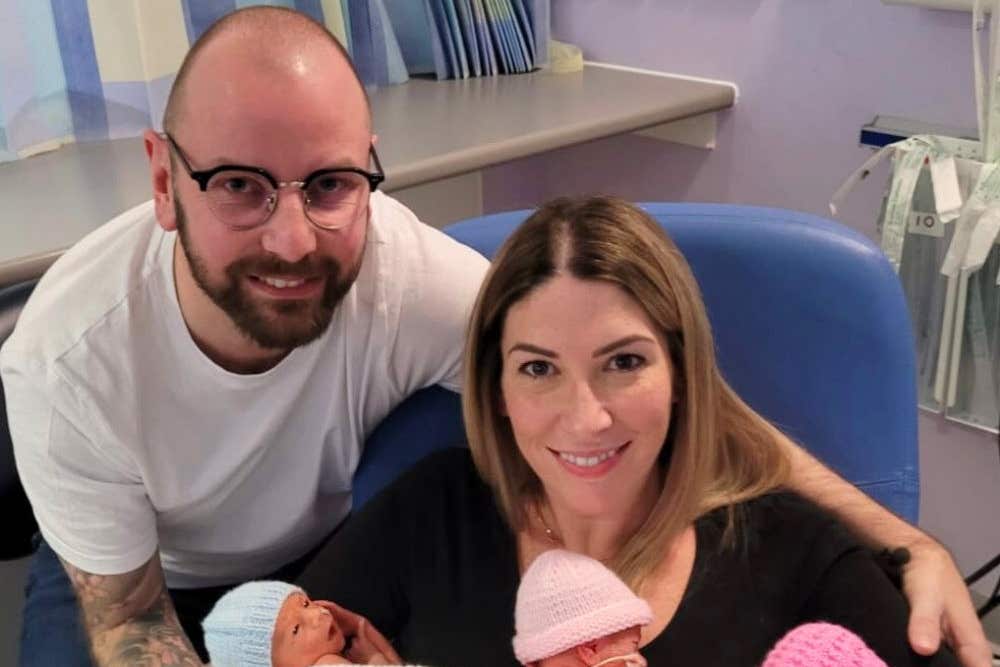 Parents Ricki and Fiona Zebik with their newly-born triplets at NHS Forth Valley Royal Hospital (Family handout)