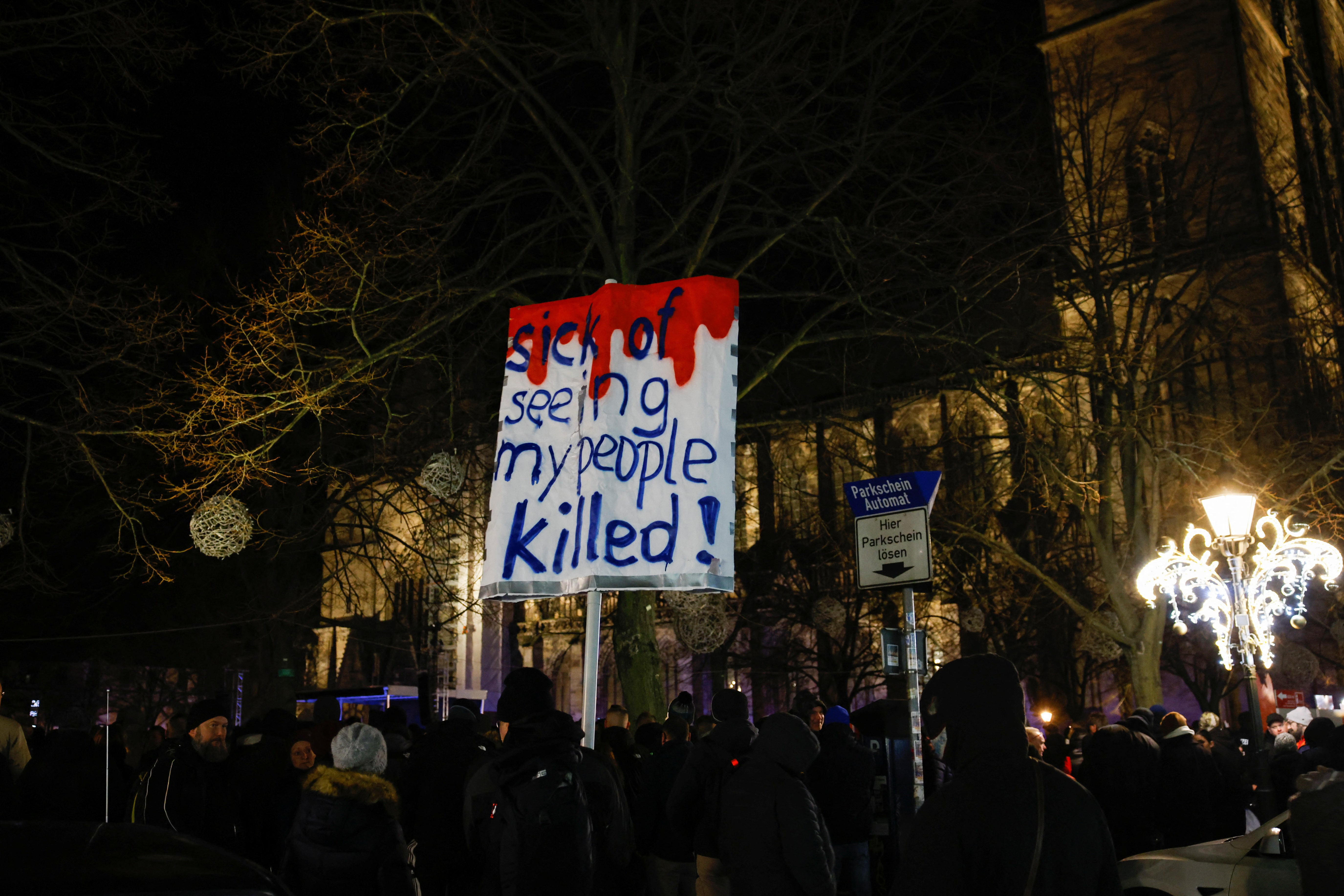 A placard as people gather near a rally of Alice Weidel, co-leader of the Alternative for Germany party (AfD)