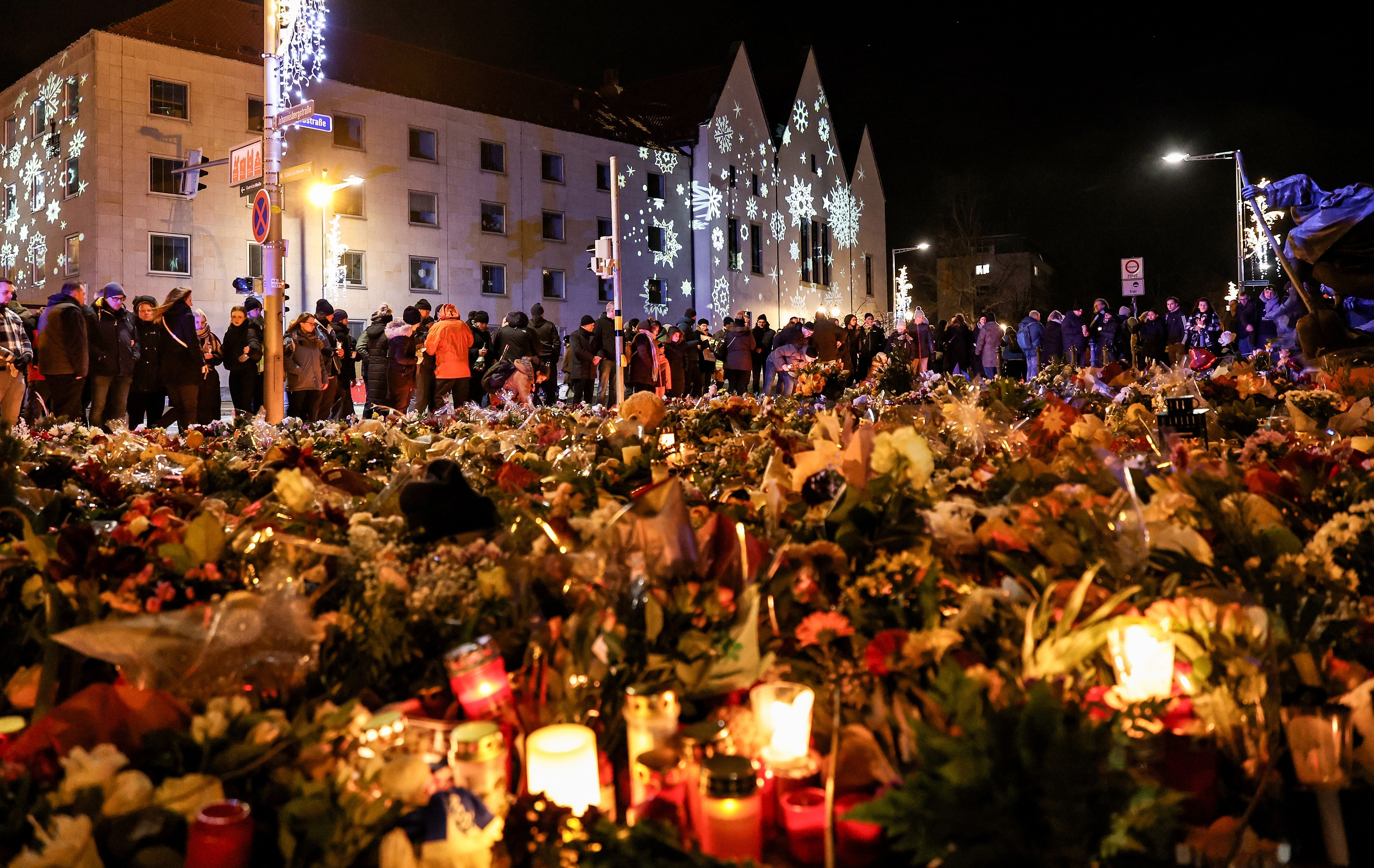 Candles and flowers outside the Johanneskirk in Magdeburg on Monday