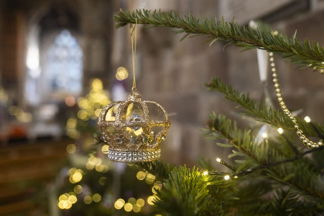 A decoration hangs on a tree during the Christmas Tree Festival at Sheffield Cathedral (Danny Lawson/PA)