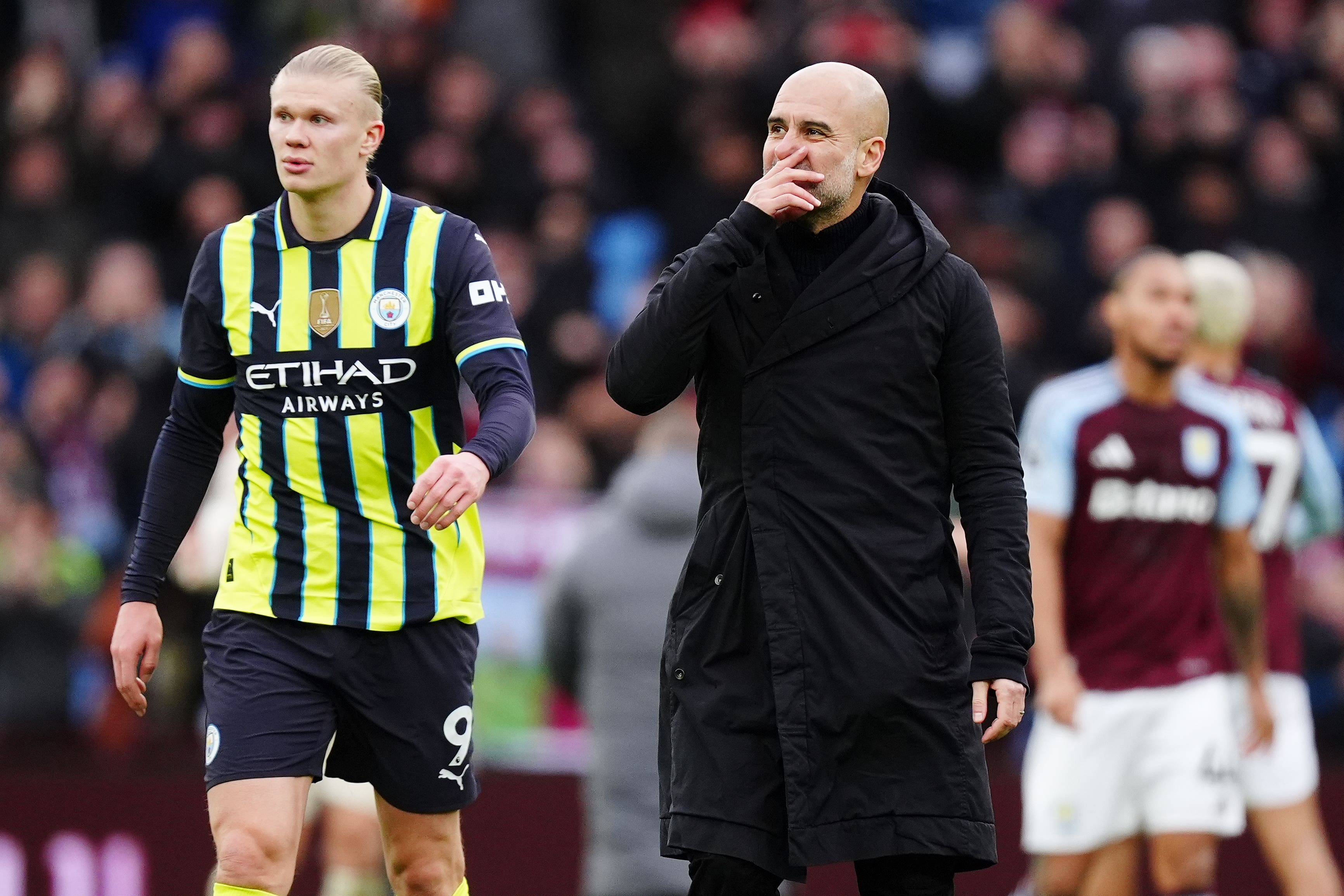 Pep Guardiola (right) has again stuck up for striker Erling Haaland (Mike Egerton/PA)