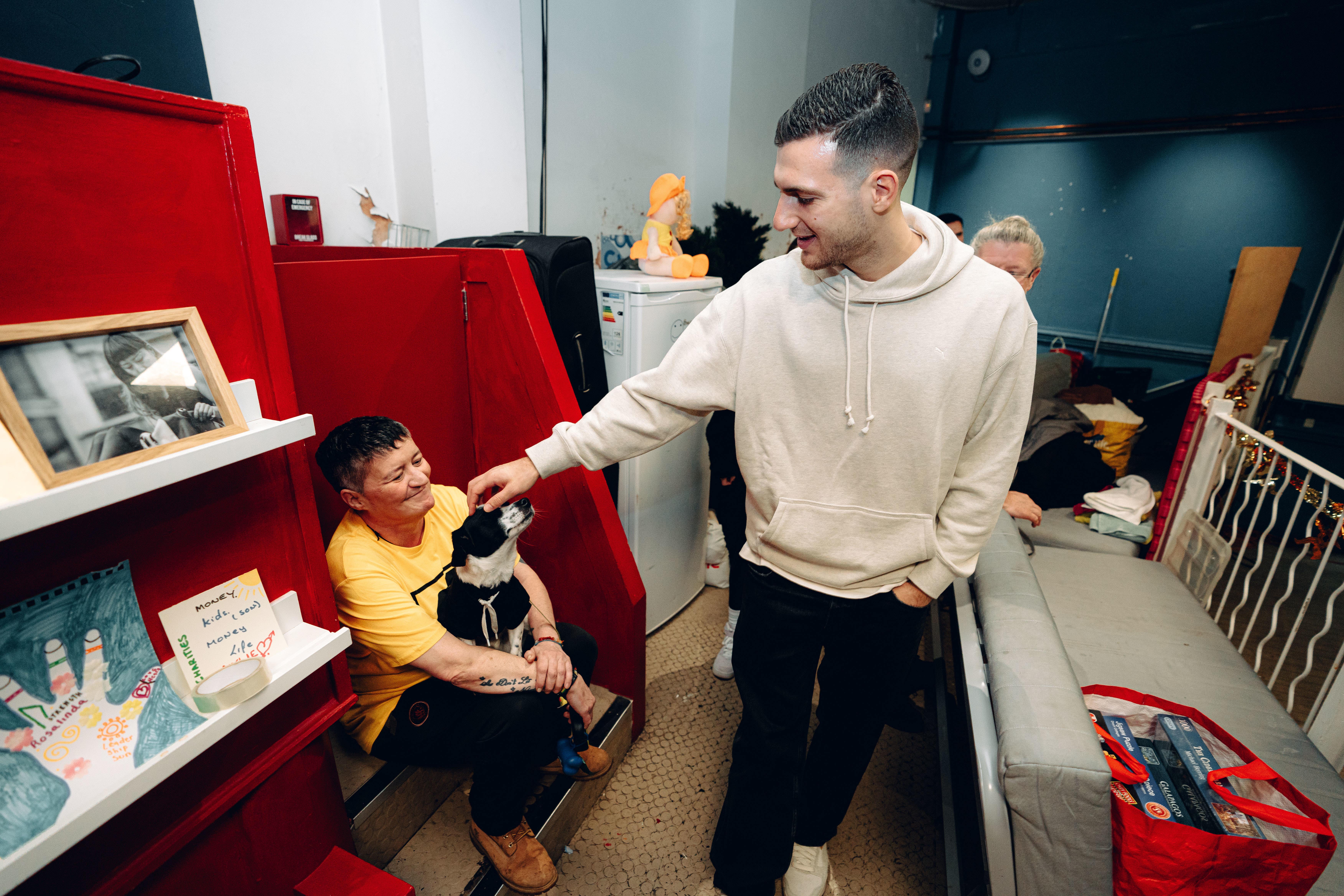 Portuguese defender Diogo Dalot, right, surprised visitors at Lifeshare with clothing and food donations (Zohaib Alam/Manchester United/PA)