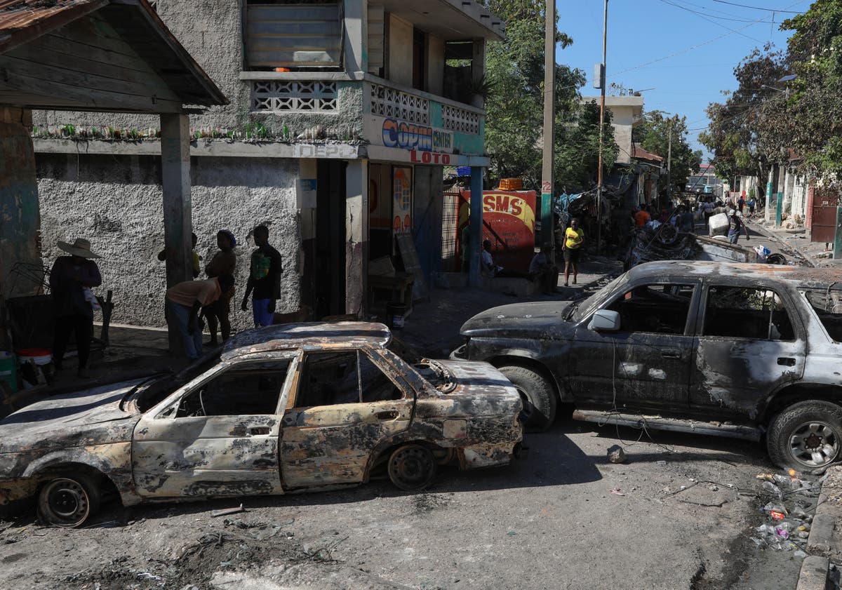 Two reporters and a police officer killed after armed men open fire at Haiti hospital reopening