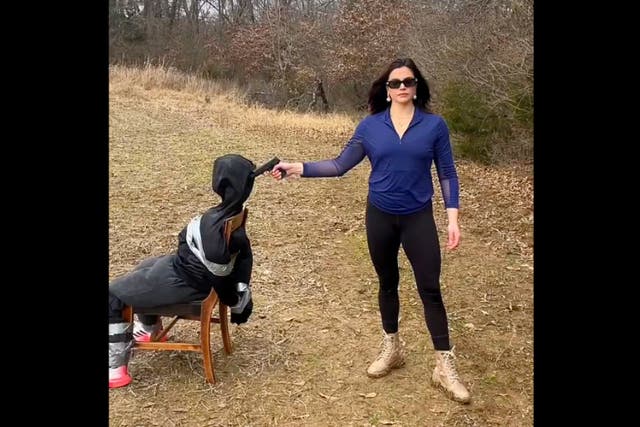 <p>Aspiring congresswoman Valentina Gomez simulates a mock execution of an immigrant</p>