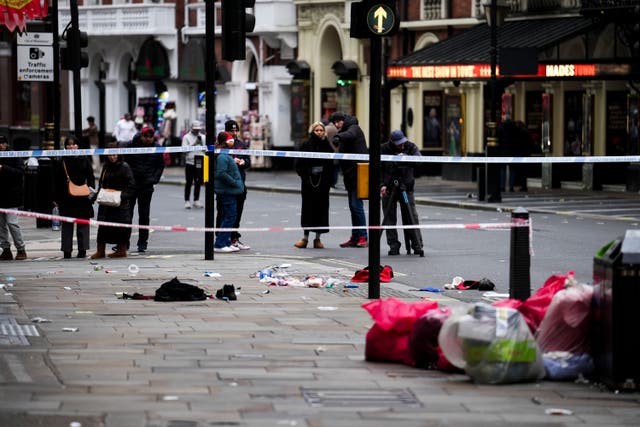 <p>The scene on Shaftesbury Avenue in central London after four people were injured after being hit by a car </p>