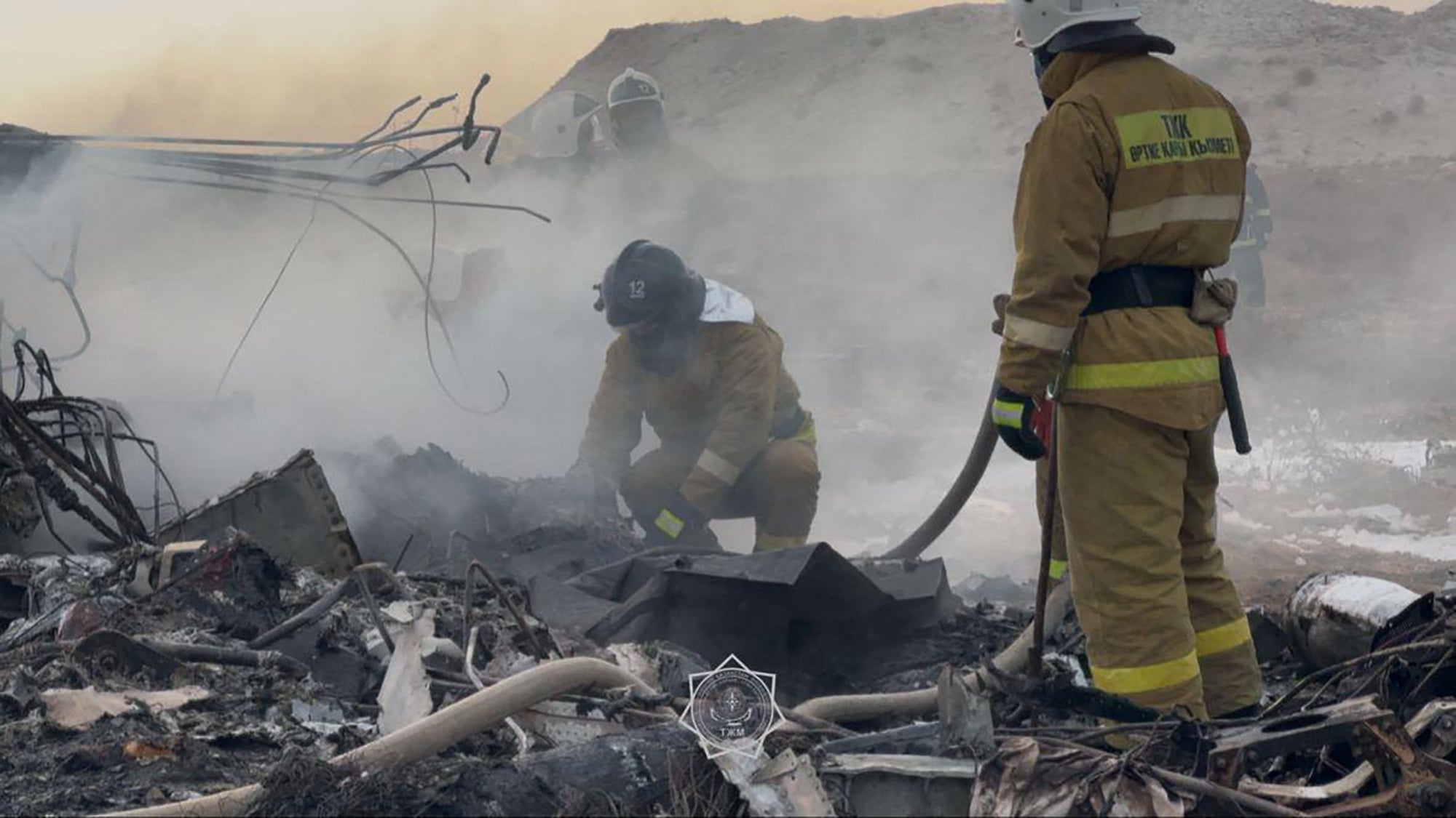 Emergency specialists work at the crash site in Kazakhstan