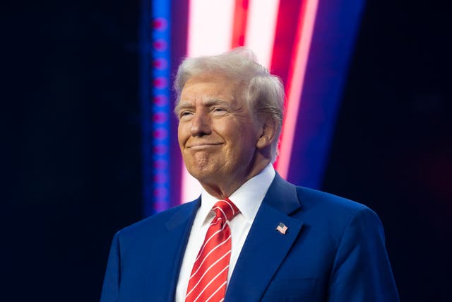 <p>U.S. President-elect Donald Trump smiles during Turning Point USA's AmericaFest at the Phoenix Convention Center on December 22, 2024 in Phoenix, Arizona</p>