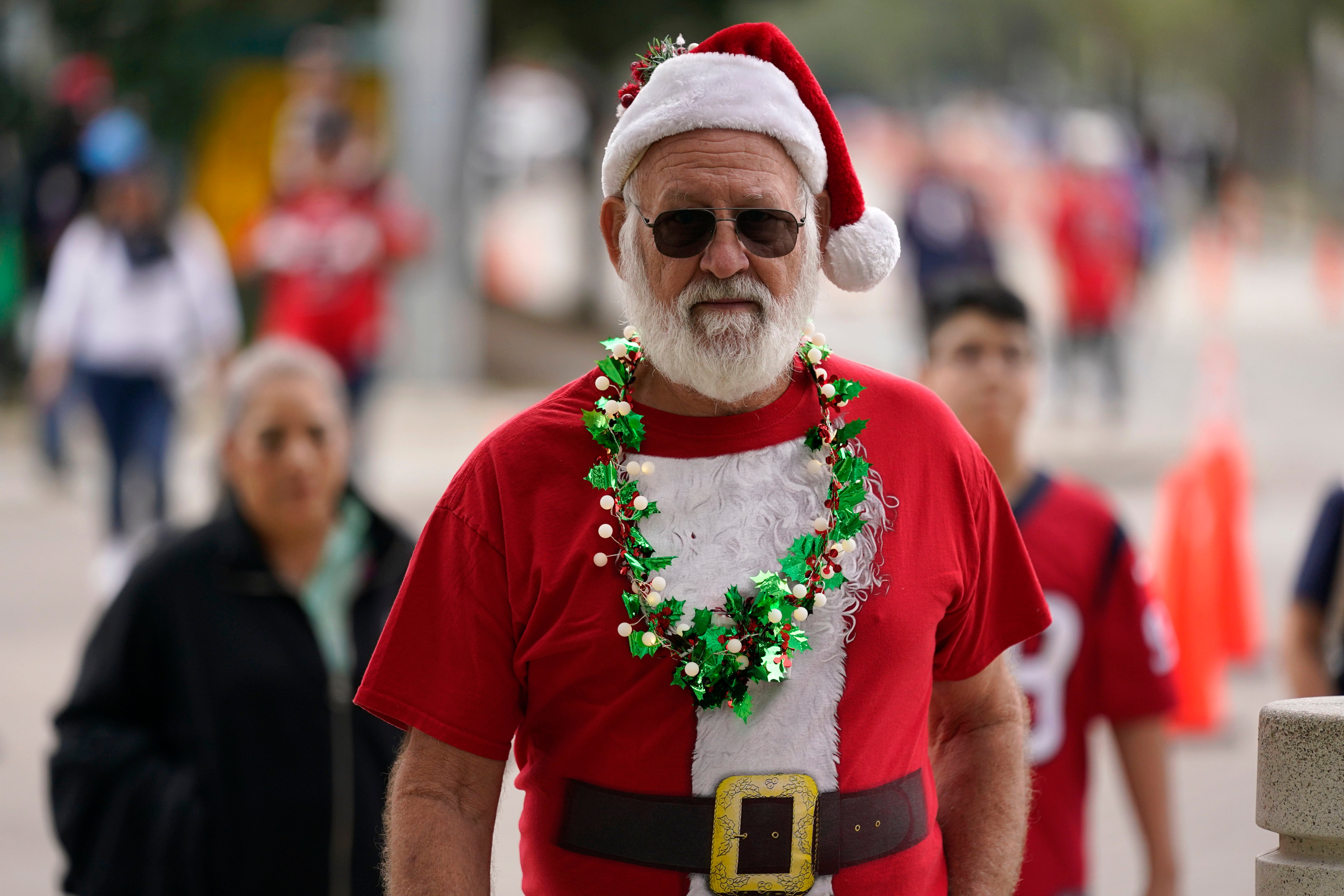 A fan arrives at NRG Stadium before NFL football game between the Houston Texans and the Baltimore Ravens