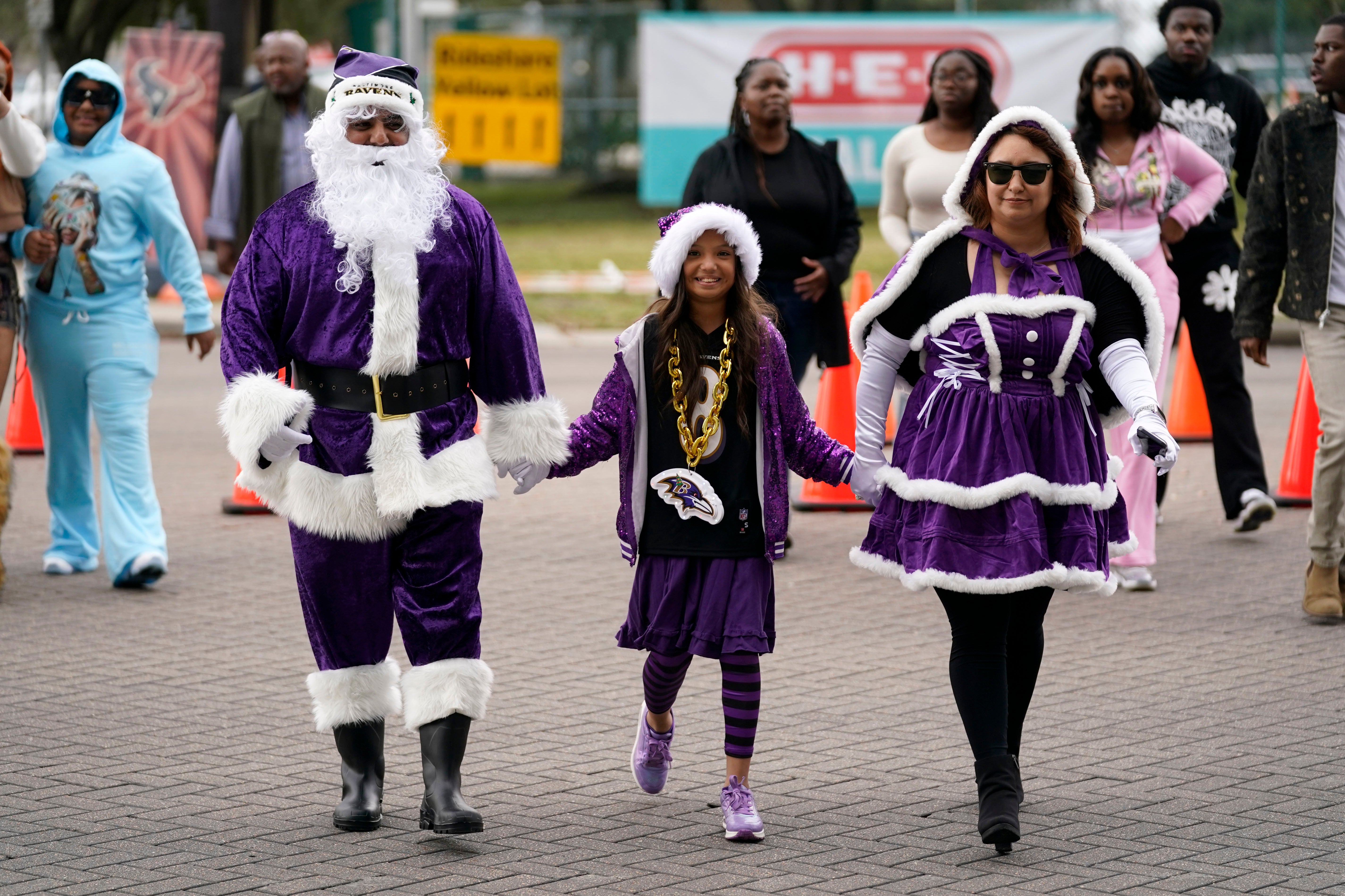 A family of Ravens fans arrive at the NRG Stadium in Houston